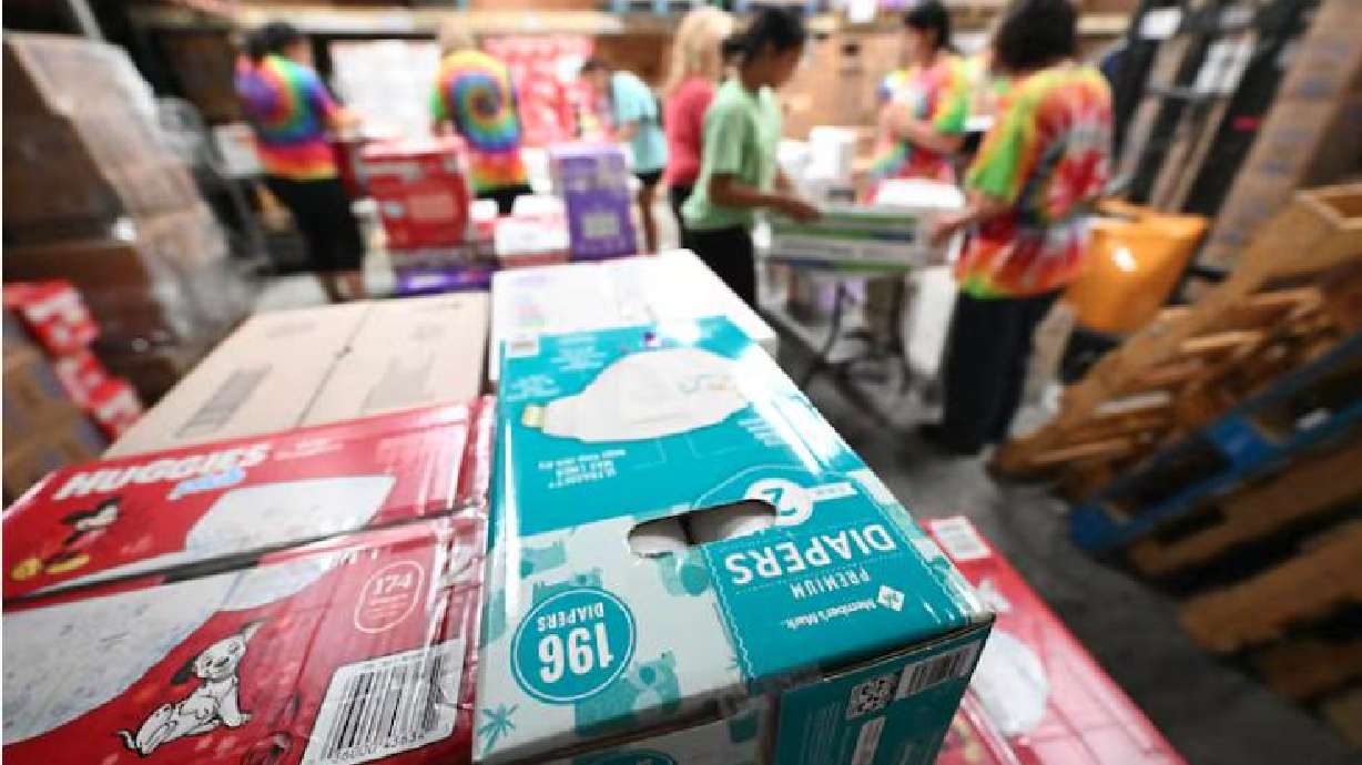 Student volunteers from Stillwater Academy label, rewrap and sort diapers at the Utah Diaper Bank in Murray, July 21, 2023.