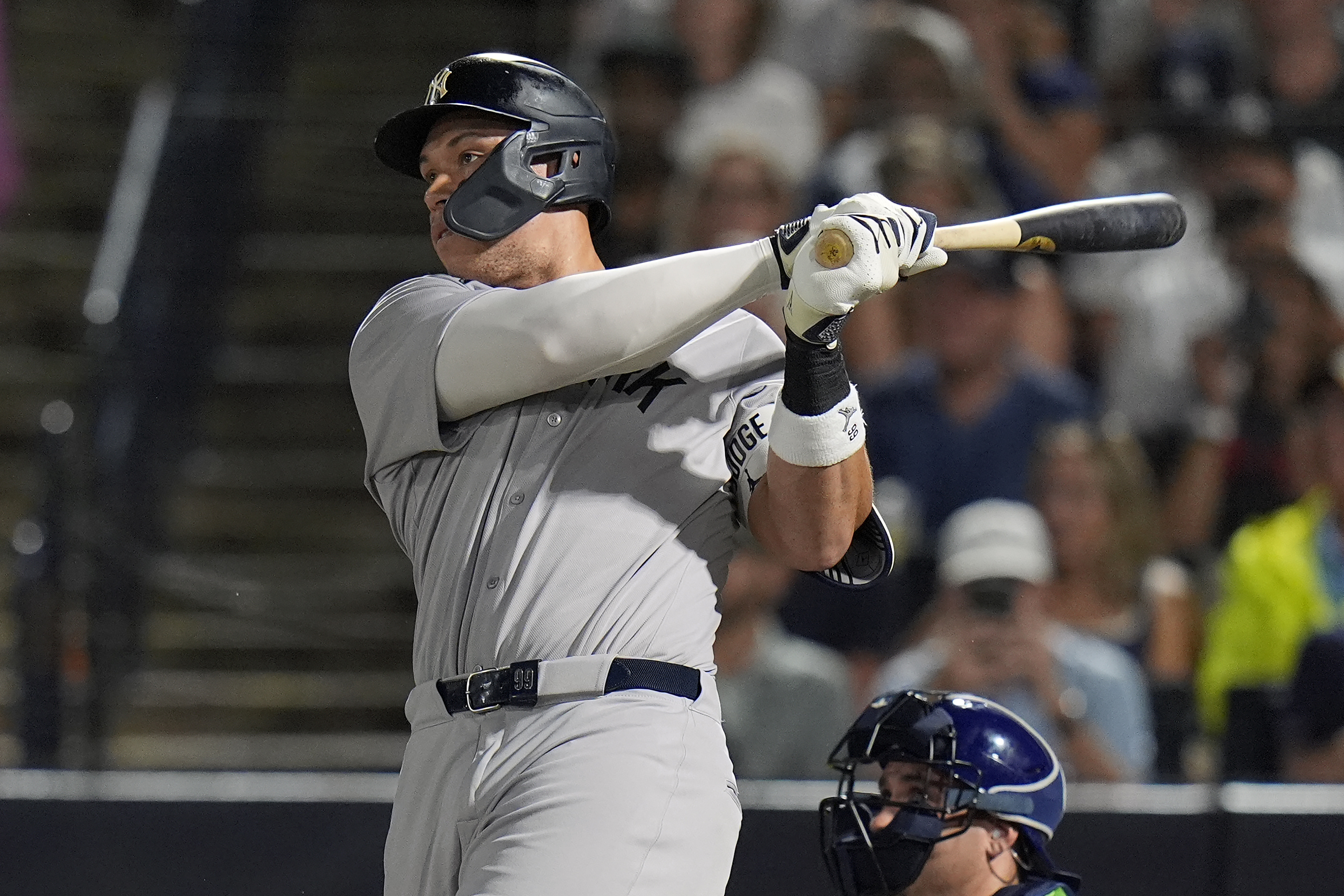 New York Yankees' Aaron Judge watches his solo home run off Tampa Bay Rays pitcher Shane Baz during the first inning of a baseball game Tuesday, Aug. 19, 2025, in Tampa, Fla. 