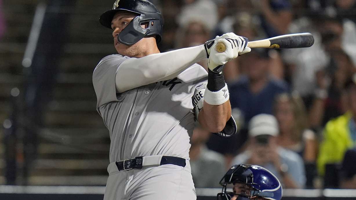 New York Yankees' Aaron Judge watches his solo home run off Tampa Bay Rays pitcher Shane Baz during the first inning of a baseball game Tuesday, Aug. 19, 2025, in Tampa, Fla.