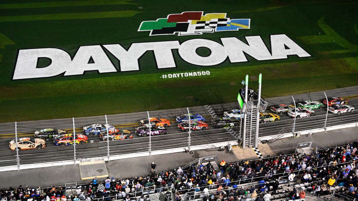 FILE - Drivers pass the start line after a caution during the NASCAR Daytona 500 auto race at Daytona International Speedway, Feb. 16, 2025, in Daytona Beach, Fla.