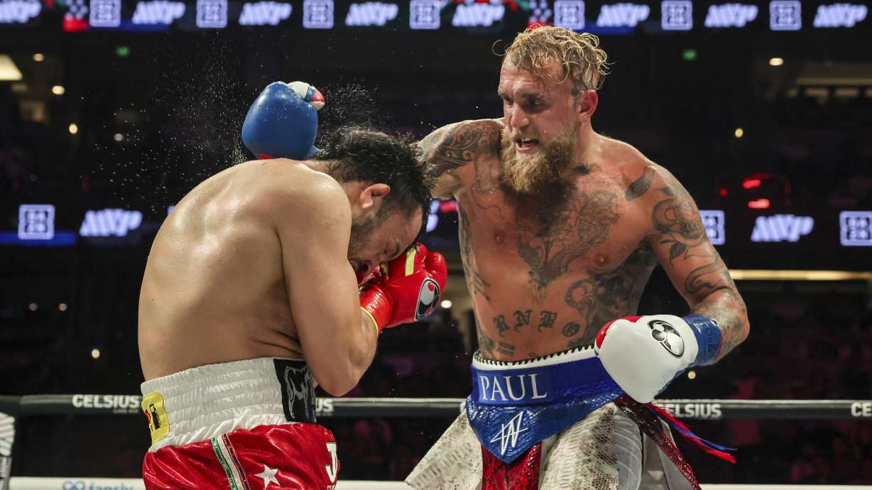 FILE - Jake Paul, right, throws a punch at Julio Cesar Chavez Jr. during their cruiserweight boxing match on June 28, 2025, in Anaheim, Calif.