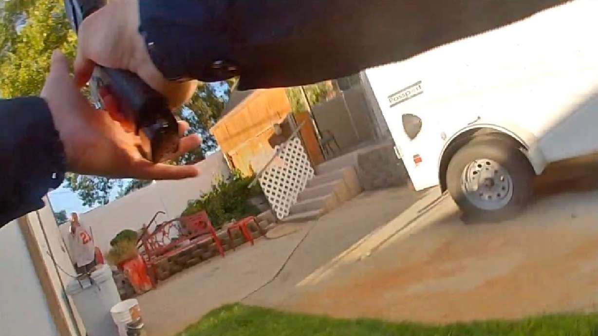 The image comes from body-camera footage of a confrontation between Roy police and Jeremy Lundgreen on Aug. 17, 2024. Lundgreen was shot by police and later died.