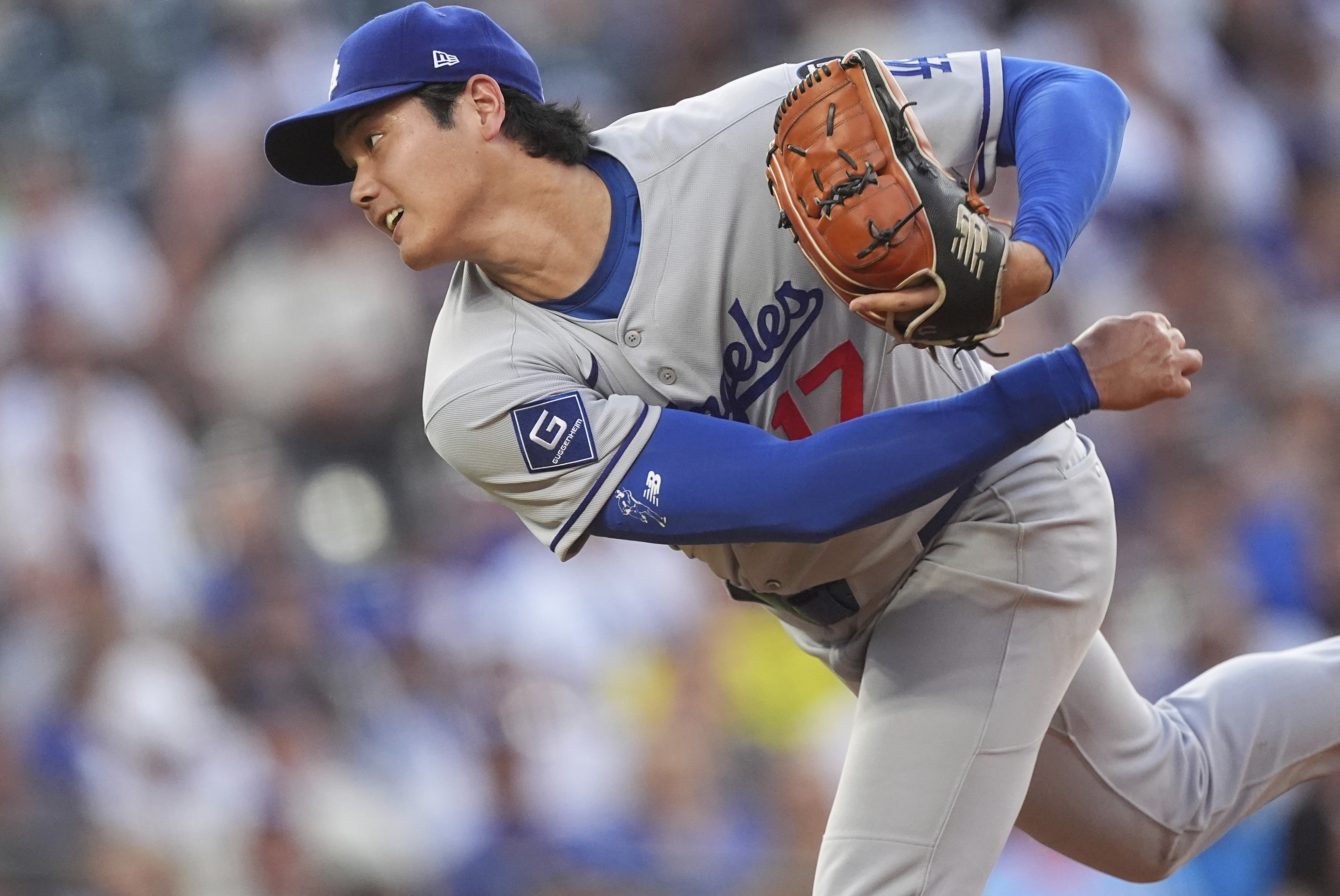 Los Angeles Dodgers starting pitcher Shohei Ohtani works against the Colorado Rockies in the second inning of a baseball game, Wednesday, Aug. 20, 2025, in Denver. 