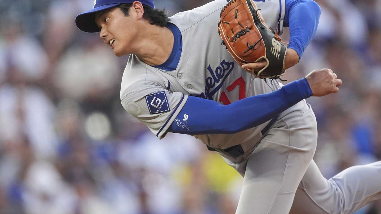Los Angeles Dodgers starting pitcher Shohei Ohtani works against the Colorado Rockies in the second inning of a baseball game, Wednesday, Aug. 20, 2025, in Denver.
