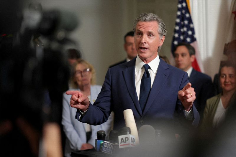 California Gov. Gavin Newsom speaks at a press conference, accompanied by members of the Texas Democratic legislators, at the governor’s mansion in Sacramento, Calif., Aug. 8.