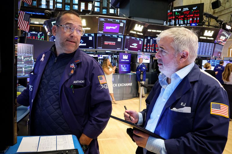 Wall Street closes down as investors brace for Powell's speech