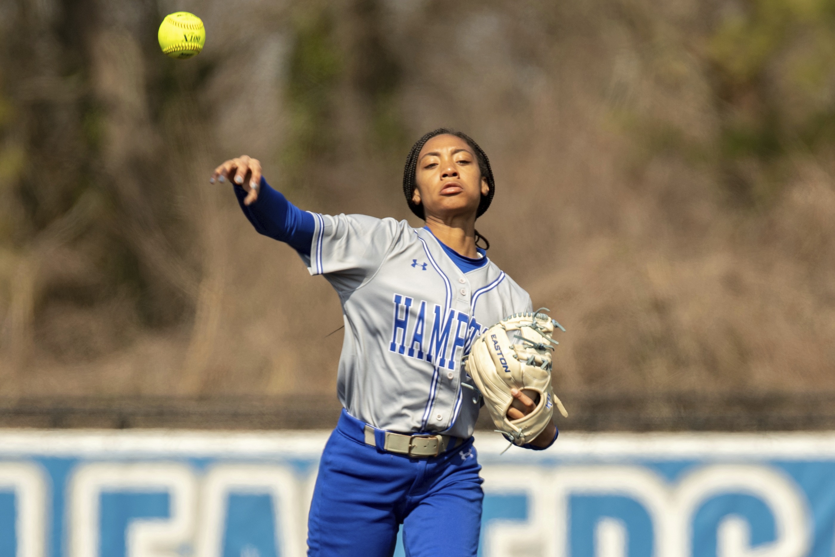 FILE - Hampton infielder Mo'ne Davis (3) fields a ground ball and throws to first base during an NCAA softball game on Sunday, March 6, 2022 in Hampton, Va. 