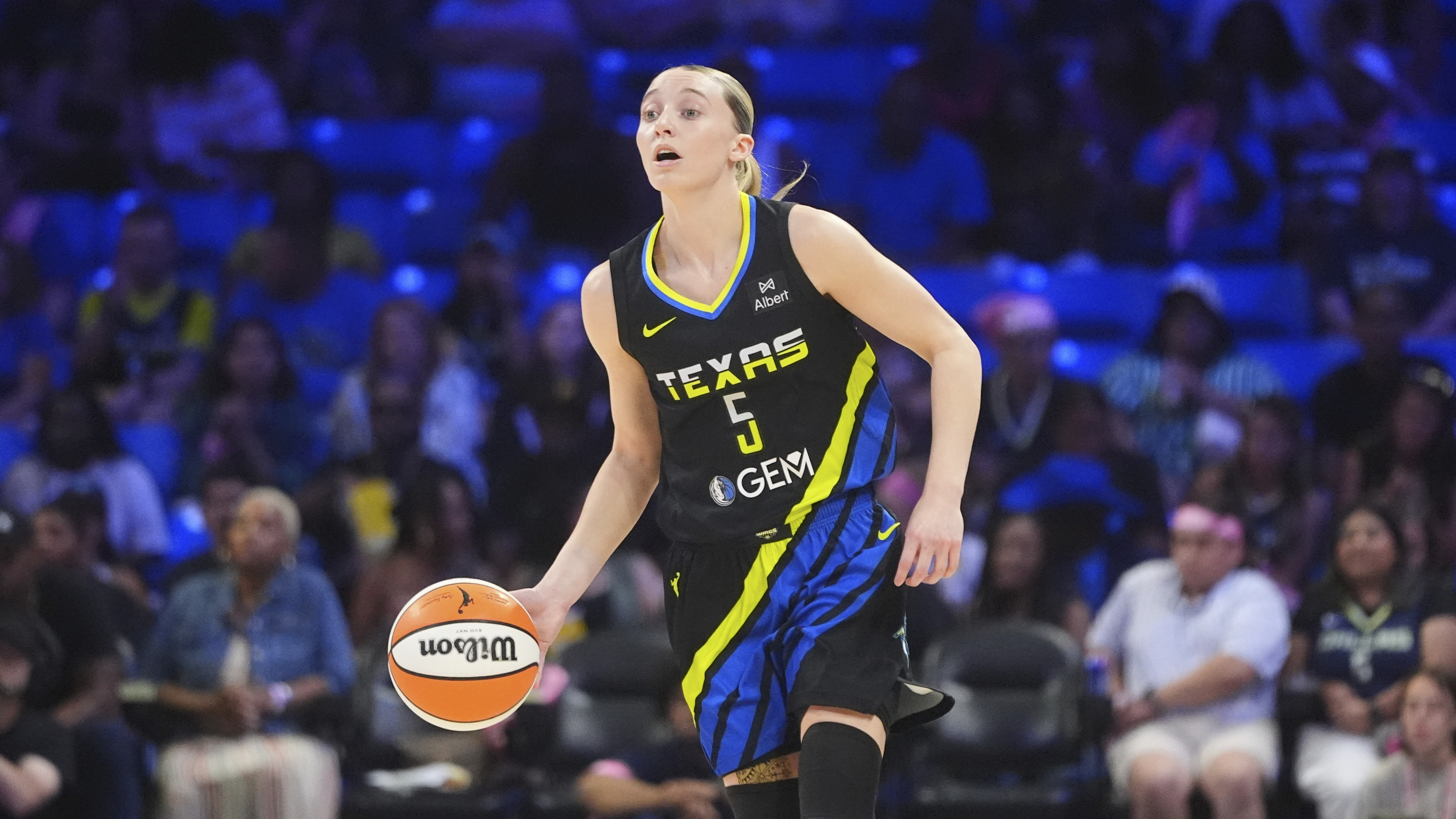 Dallas Wings guard Paige Bueckers (5) dribbles during the first half of a WNBA basketball game against the Los Angeles Sparks in Arlington, Texas, Friday, Aug. 15, 2025. 