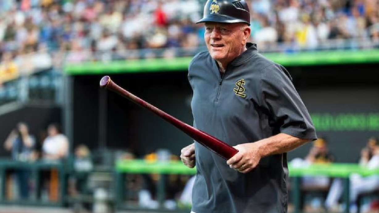 Gene Chidester, 76, batboy for the Salt Lake Bees, runs to the visiting team’s dugout after retrieving a bat during a Minor League Baseball game between the Bees and the Las Vegas Aviators at The Ballpark at America First Square in South Jordan, Aug. 5.