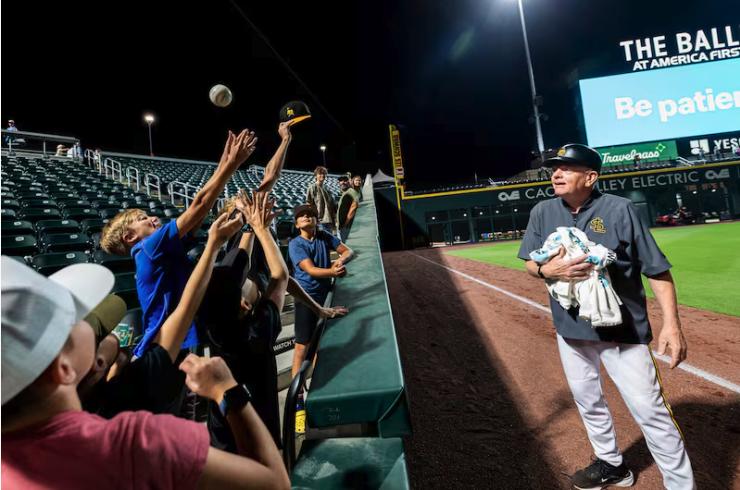Gene Chidester, 76, a batboy for the Salt Lake Bees, watches as kids swarm around a ball he threw to them after a Minor League Baseball game between the Bees and the Las Vegas Aviators held at The Ballpark at America First Square in South Jordan on Aug. 5.