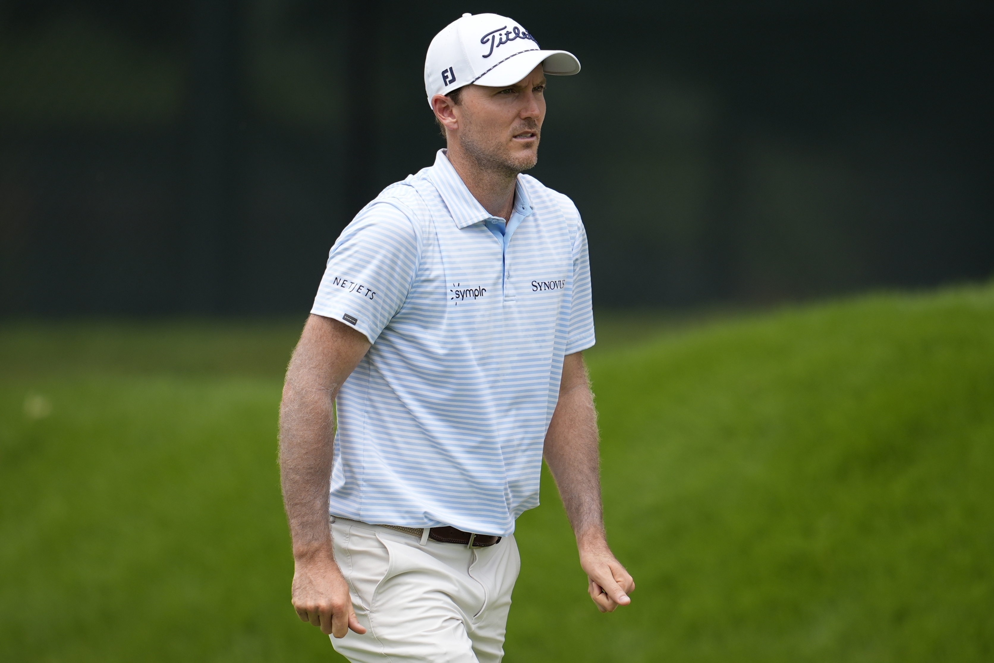 Russell Henley walks on the first fairway during the first round of the Tour Championship golf tournament, Thursday, Aug. 21, 2025, in Atlanta.