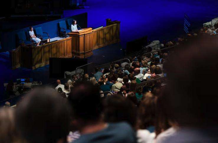 The audience watches as Sister Kristin M. Yee, second counselor in the Relief Society general presidency of The Church of Jesus Christ of Latter-day Saints, speaks during a session held as part of BYU Education Week at the Marriott Center on the campus of Brigham Young University in Provo on Thursday.