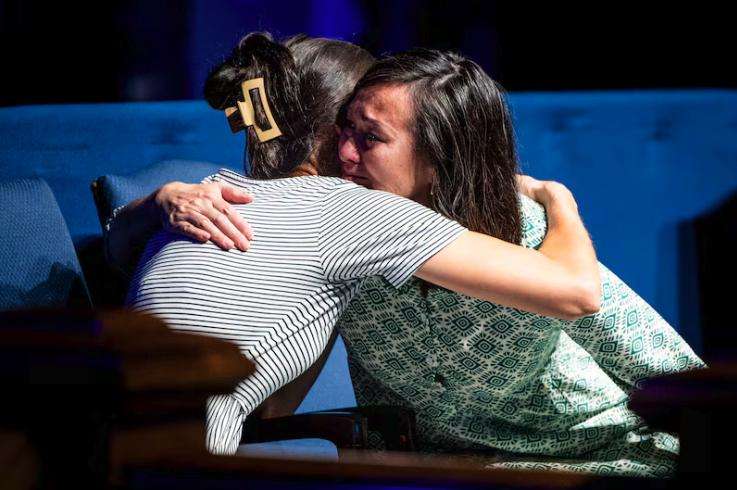 Sister Kristin M. Yee, right, second counselor in the Relief Society general presidency of The Church of Jesus Christ of Latter-day Saints, hugs her sister, Dawn Peterson, after Sister Yee spoke during a session held as part of BYU Education Week at the Marriott Center on the campus of Brigham Young University in Provo on Thursday.