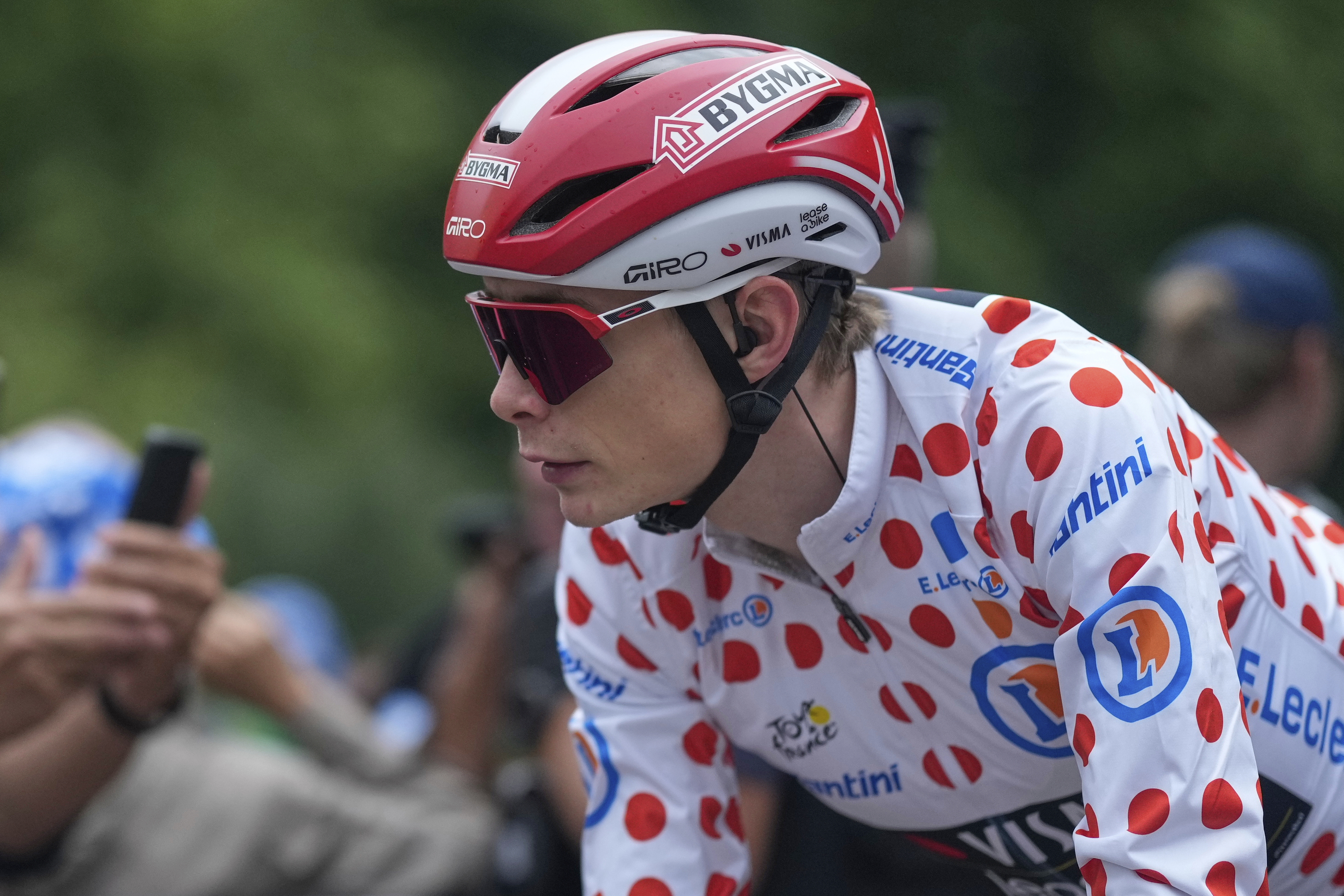 FILE - Denmark's Jonas Vingegaard, wearing the best climber's dotted jersey, arrives for the start of the twenty-first stage of the Tour de France cycling race over 132.3 kilometers (82.1 miles) with start in Mantes-la-Ville and finish on the Champs-Elysees in Paris, France, Sunday, July 27, 2025.