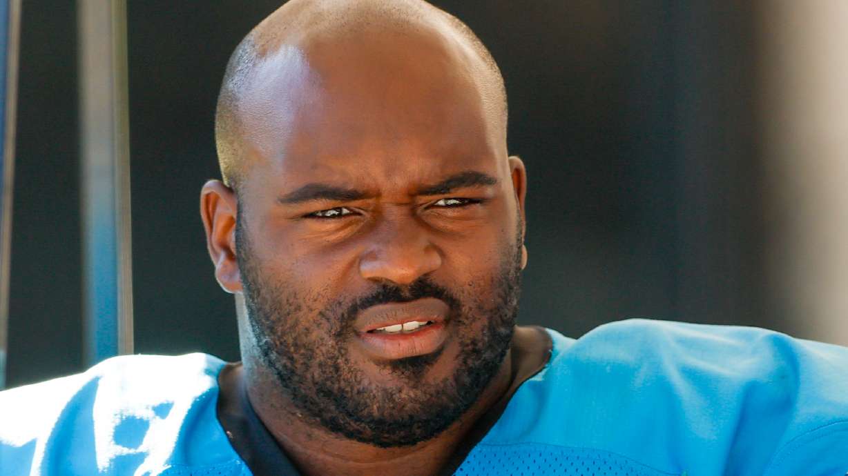 FILE - Carolina Panthers tackle Taylor Moton rides in a cart to the team's NFL football training camp in Charlotte, N.C., Saturday, July 26, 2025.