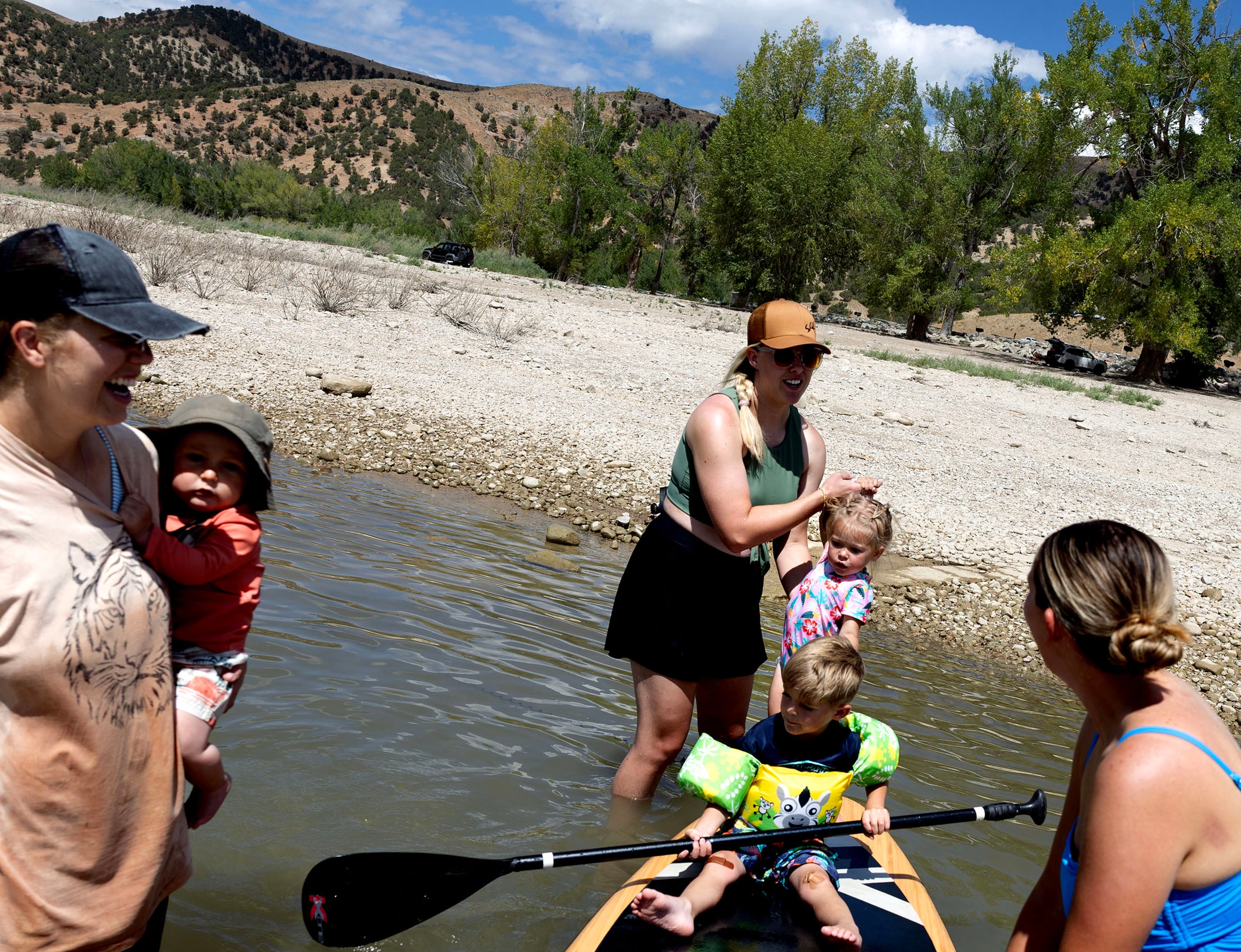 Bree Buckner, Kaylie Richins and Jessica Keisel play with their children at Echo Reservoir in Coalville on Friday.