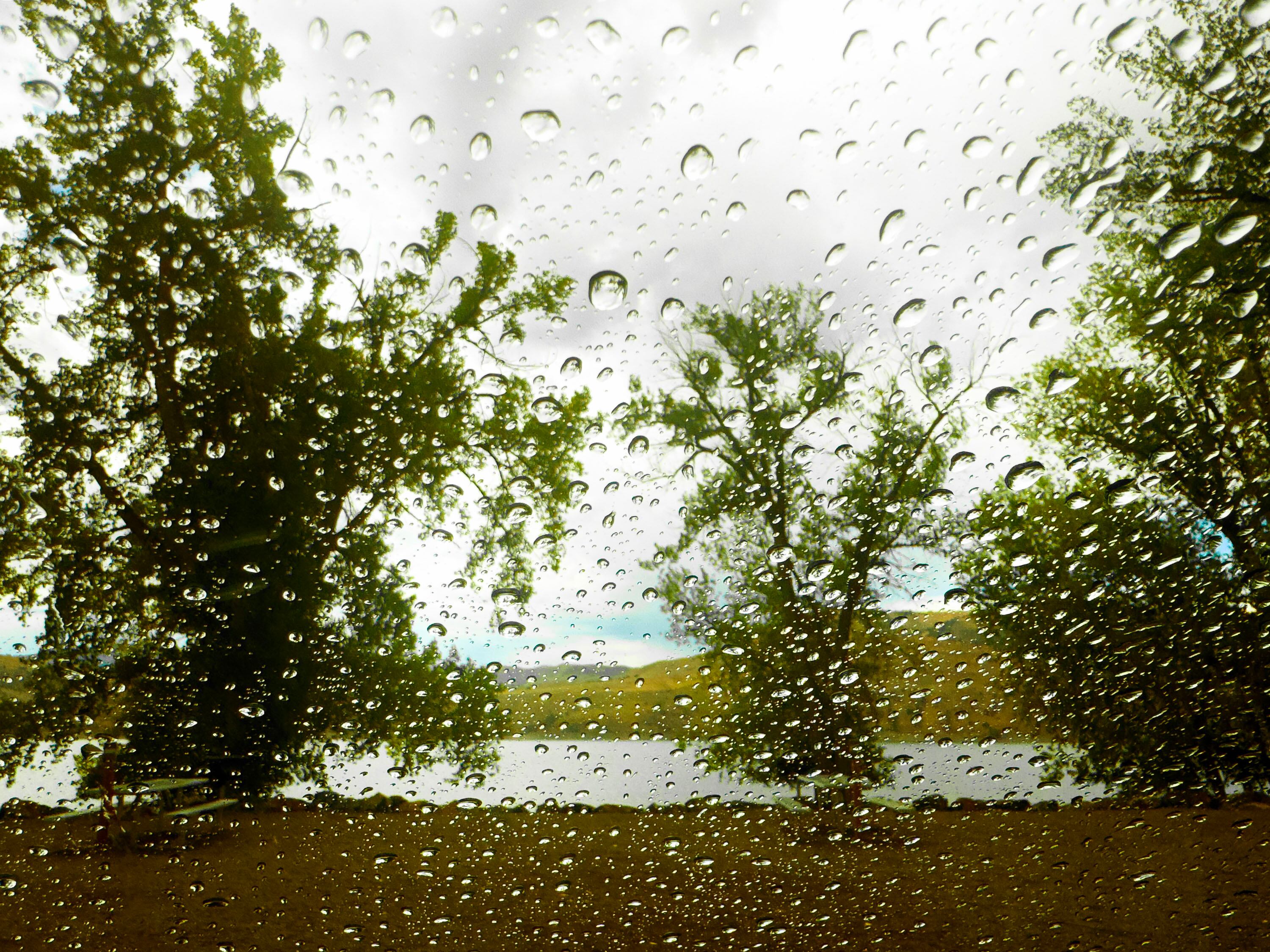 A brief rain shower falls at Echo State Park in Coalville on Friday.