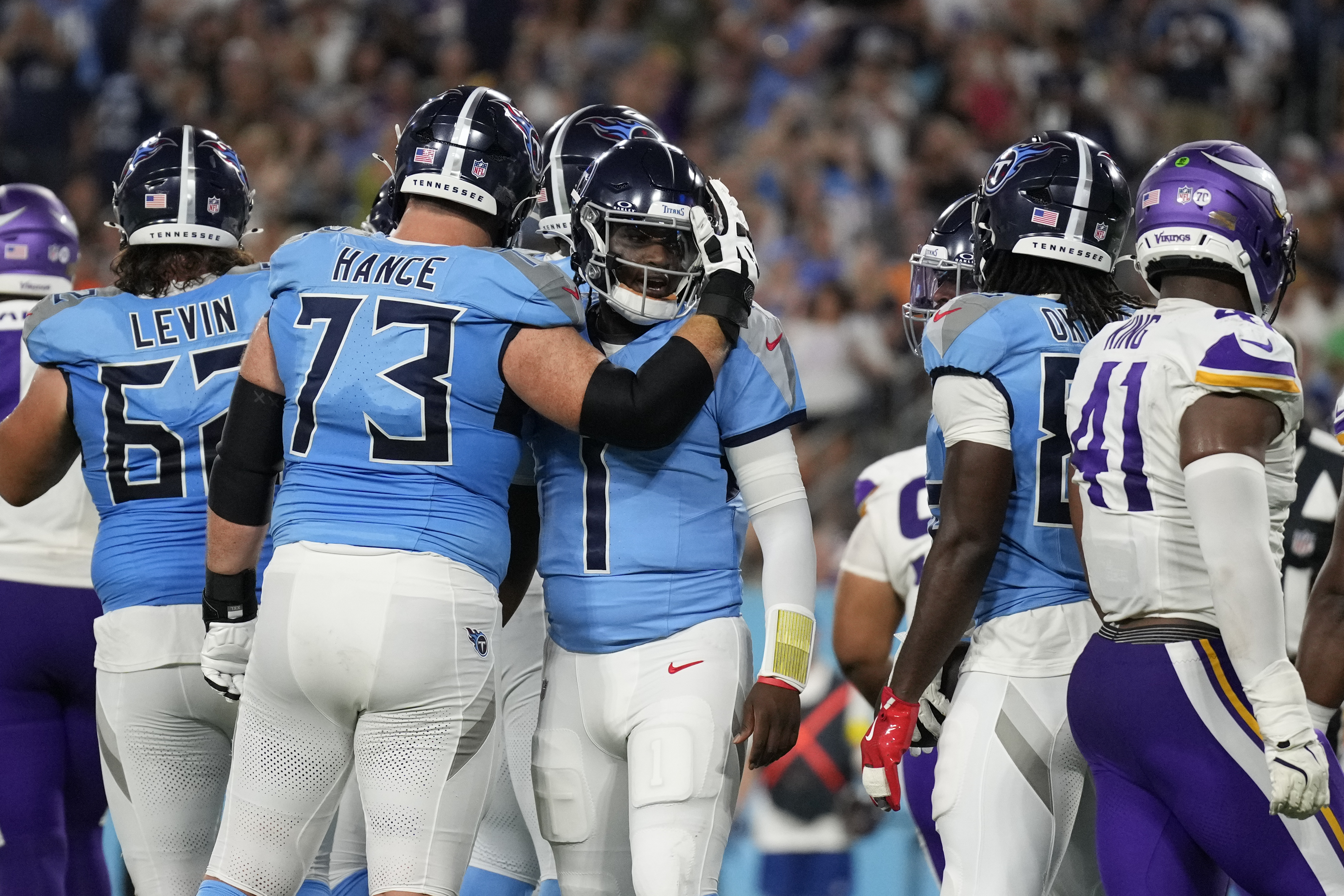Tennessee Titans quarterback Cam Ward (1) celebrates with guard Blake Hance (73) after a touchdown by running back Julius Chestnut (36) during the first half of a preseason NFL football game against the Minnesota Vikings, Friday, Aug. 22, 2025, in Nashville, Tenn. 