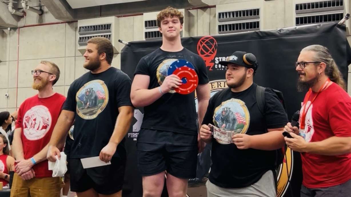 Jack Livingston, center, earns first place in the 15- to 17-year-old category in the Strongman Corporation's America's Strongest Teen competition on Aug. 2 in Sacramento, California.