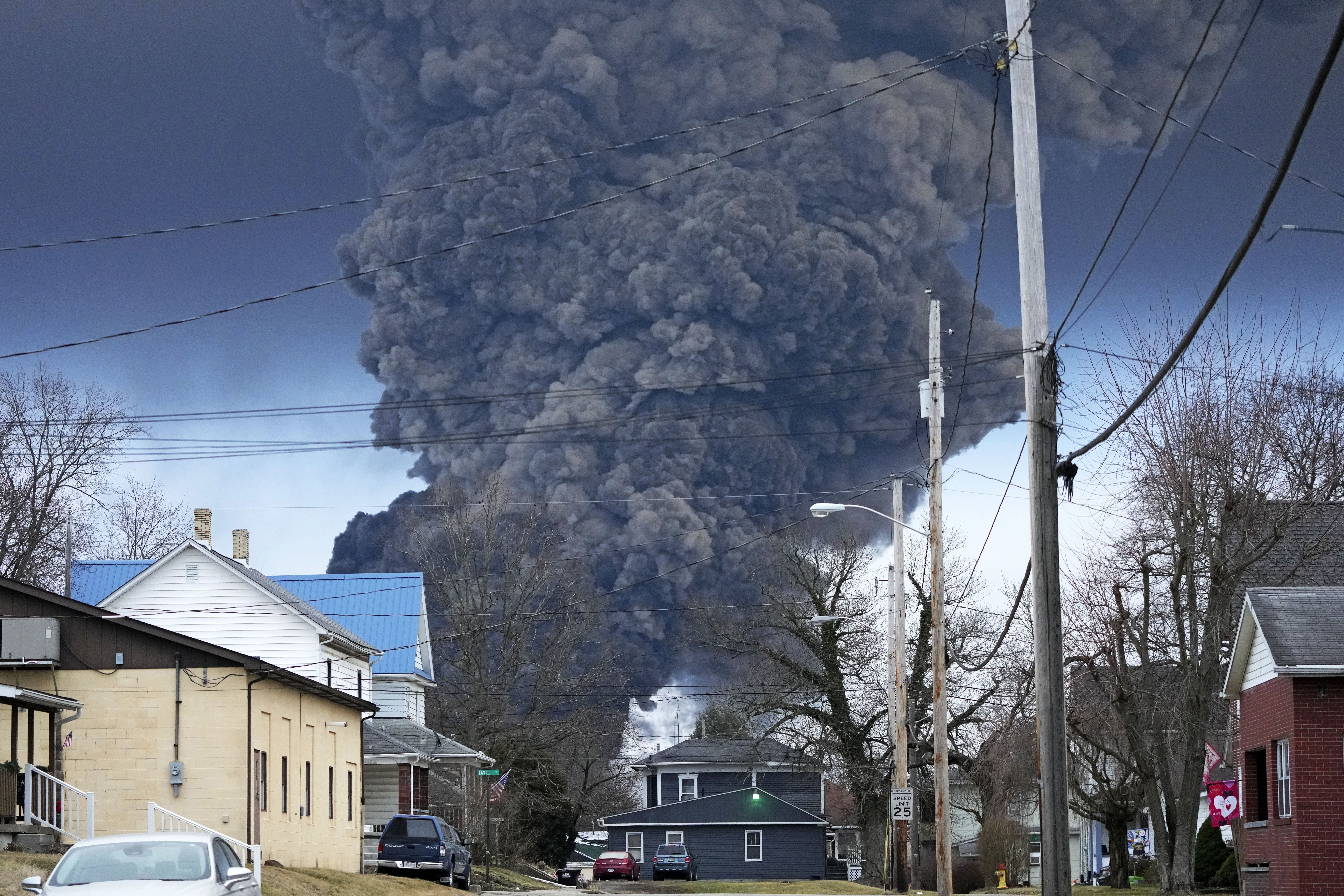 A black plume rises over East Palestine, Ohio, as a result of a controlled detonation of a portion of the derailed Norfolk Southern trains, Feb. 6, 2023. 