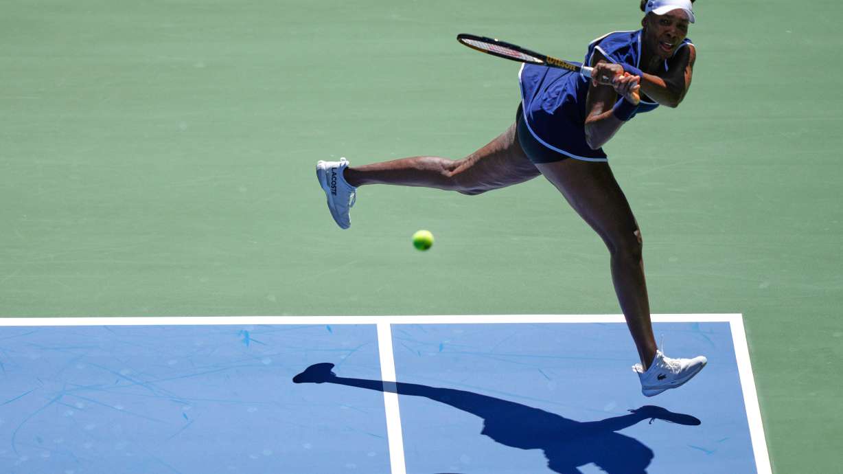 Venus Williams returns a shot during the mixed doubles competition of the U.S. Open tennis tournament in New York, Tuesday, Aug. 19, 2025.