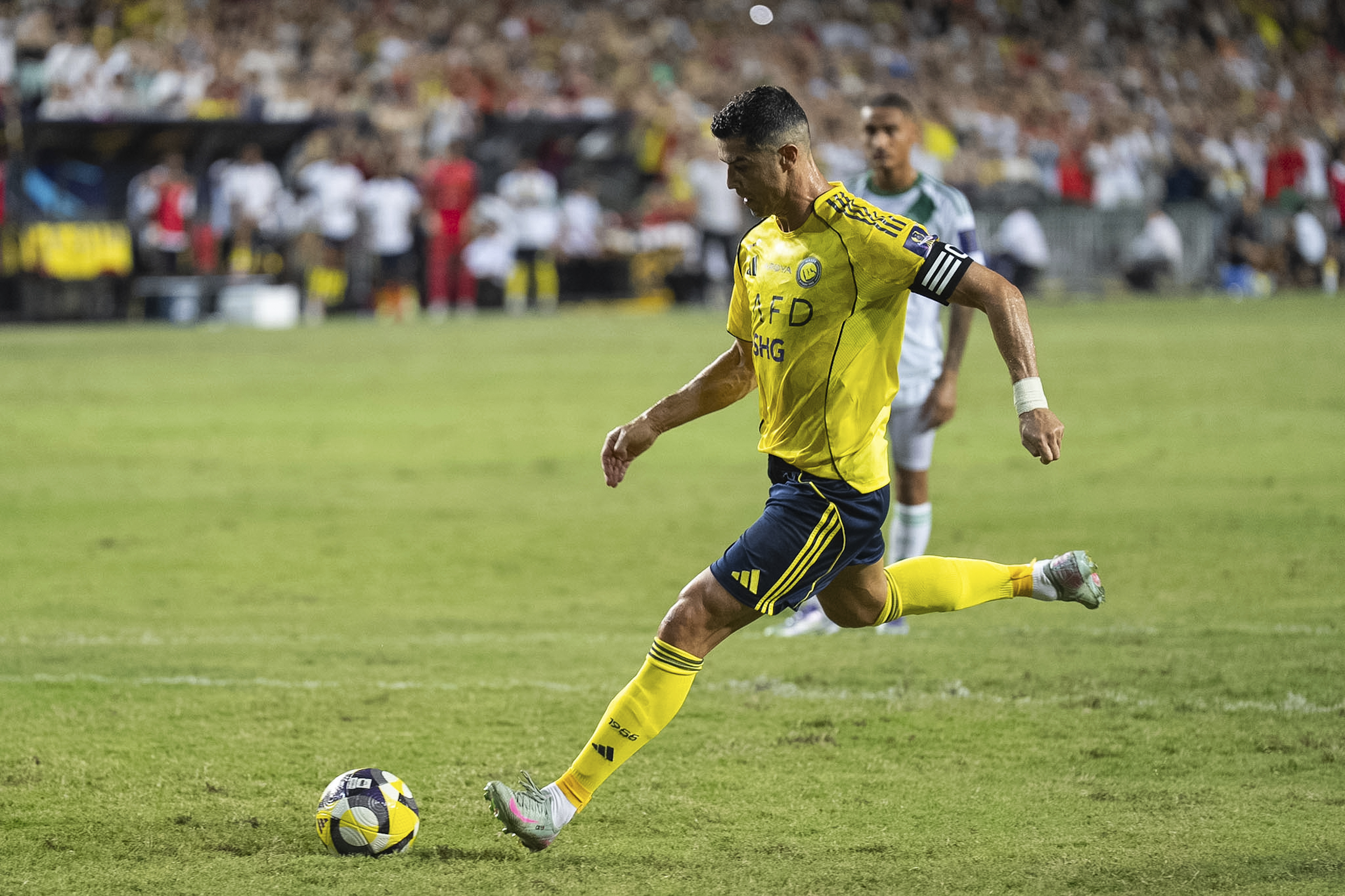 Al Nassr's Cristiano Ronaldo scores a goal with a penalty kick during the Saudi Super Cup final soccer match between Al Ahli and Al Nassr at the Hong Kong Stadium in Hong Kong, Saturday, Aug. 23, 2025. 