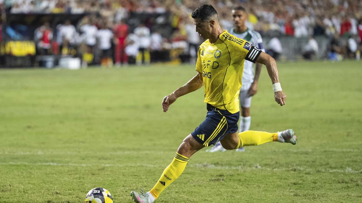 Al Nassr's Cristiano Ronaldo scores a goal with a penalty kick during the Saudi Super Cup final soccer match between Al Ahli and Al Nassr at the Hong Kong Stadium in Hong Kong, Saturday, Aug. 23, 2025.