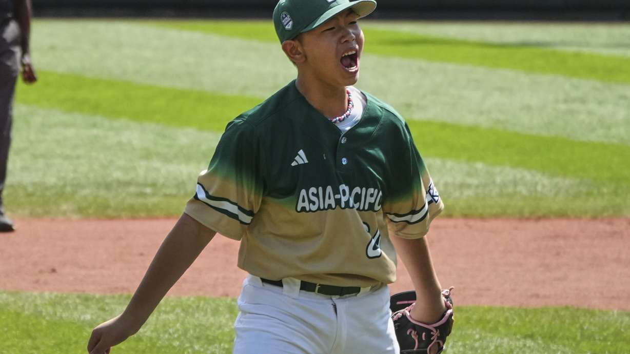 Taiwan's Chen Qi-Sheng (24) celebrates after getting the final out of the International Championship baseball game against Aruba at the Little League World Series tournament in South Williamsport, Pa., Saturday, Aug. 23, 2025.
