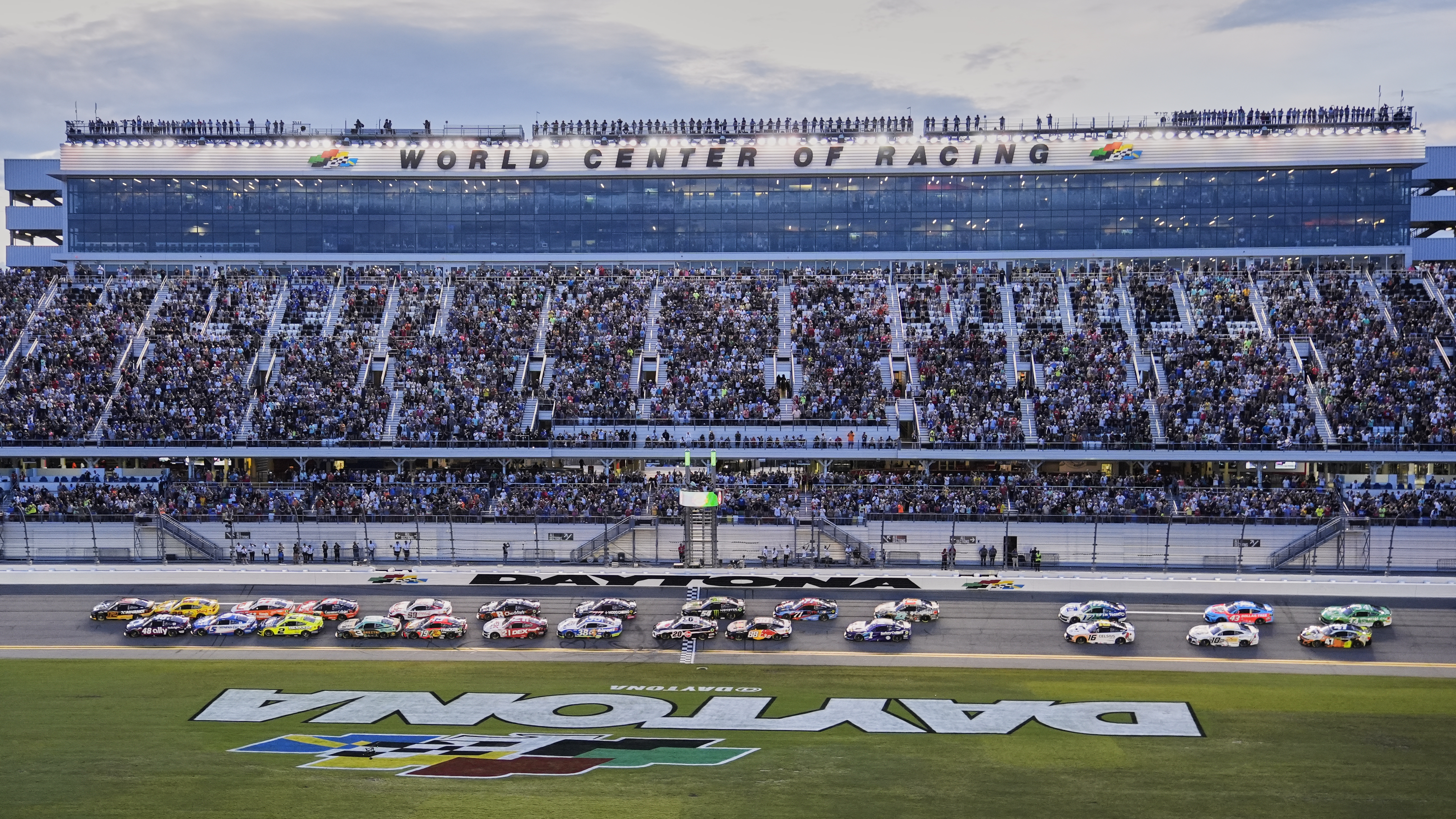 Ryan Blaney and Alex Bowman, far left, lead the field to start a NASCAR Cup Series auto race at Daytona International Speedway, Saturday, Aug. 23, 2025, in Daytona Beach, Fla. 
