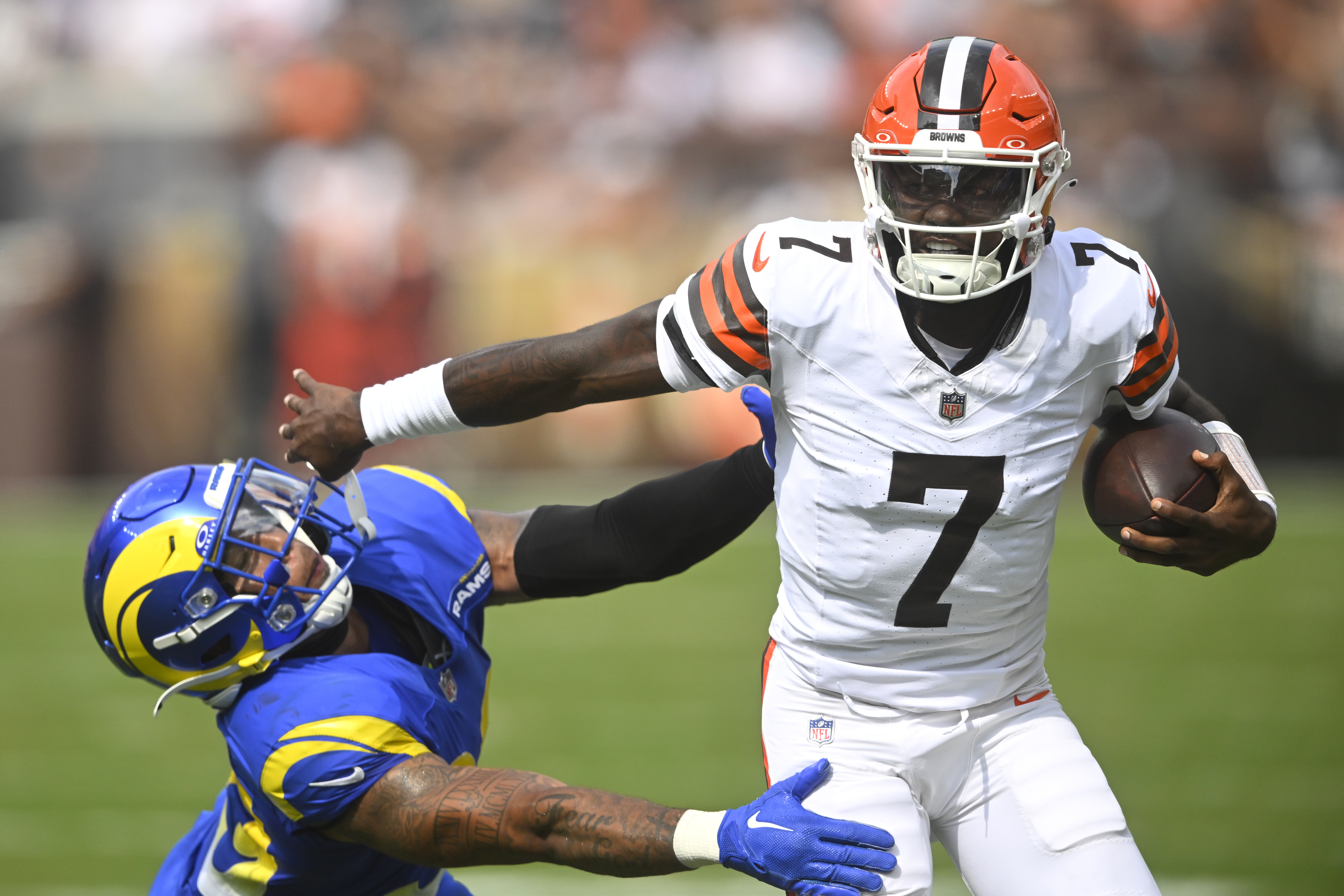 Cleveland Browns quarterback Tyler Huntley (7) runs against Los Angeles Rams safety Malik Dixon-Williams (39) in the second half of an NFL preseason football game Saturday, Aug. 23, 2025, in Cleveland. 