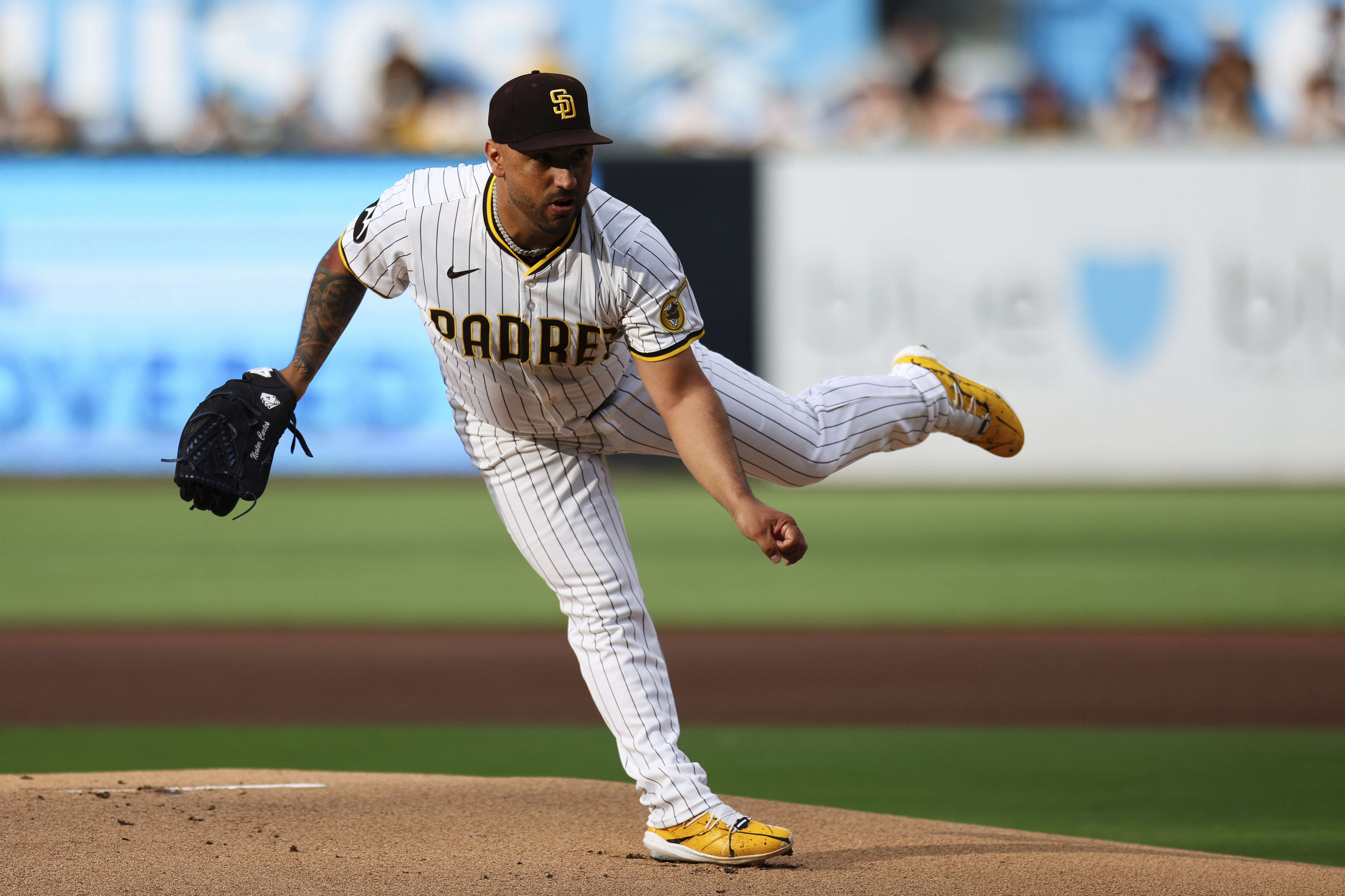 San Diego Padres' Nestor Cortes follows through on a pitch against the Los Angeles Dodgers in the first inning of a baseball game Saturday, Aug. 23, 2025, in San Diego. 