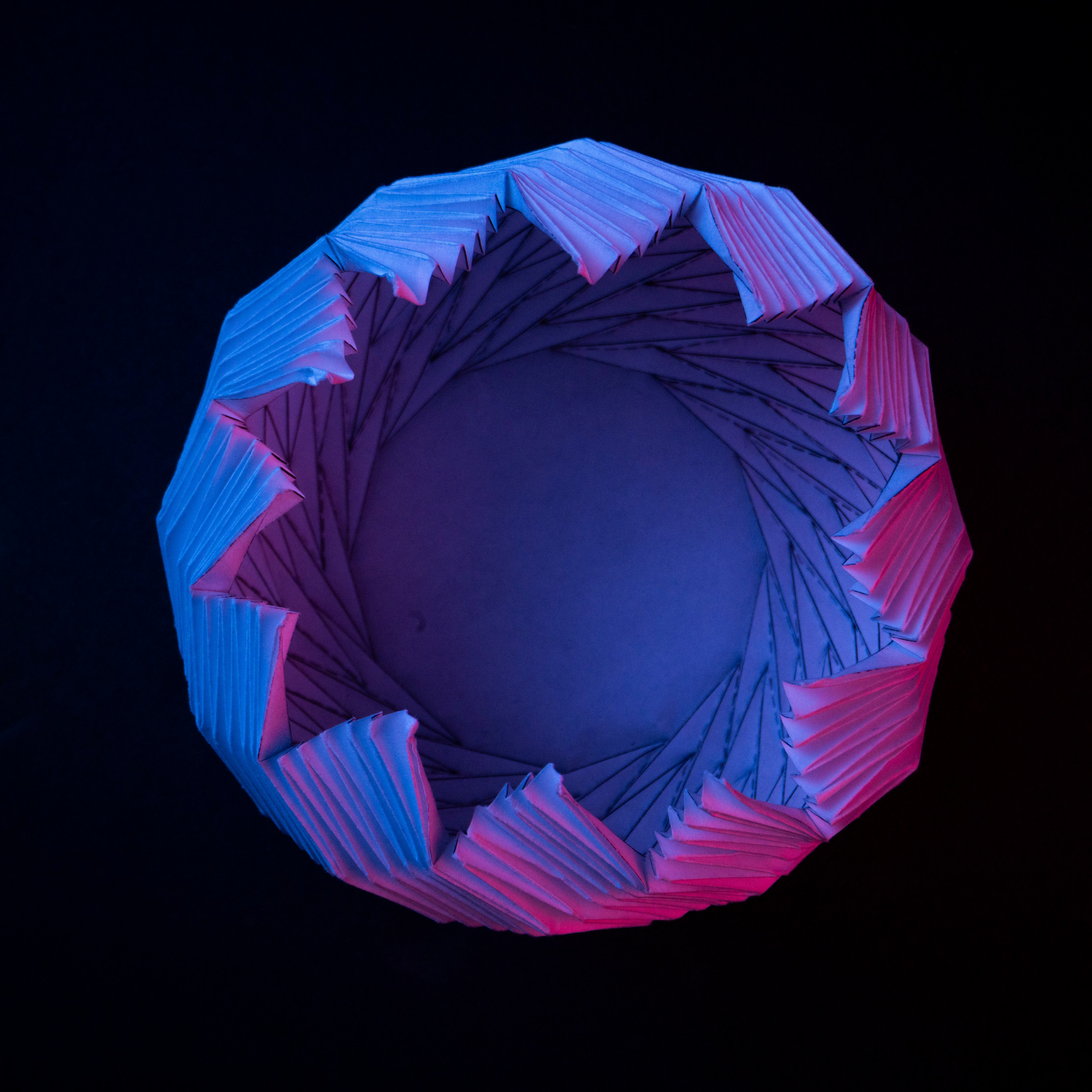 A new flower-bloom origami pattern that Brigham Young University student Kelvin (Zhongyuan) Wang discovered is displayed.