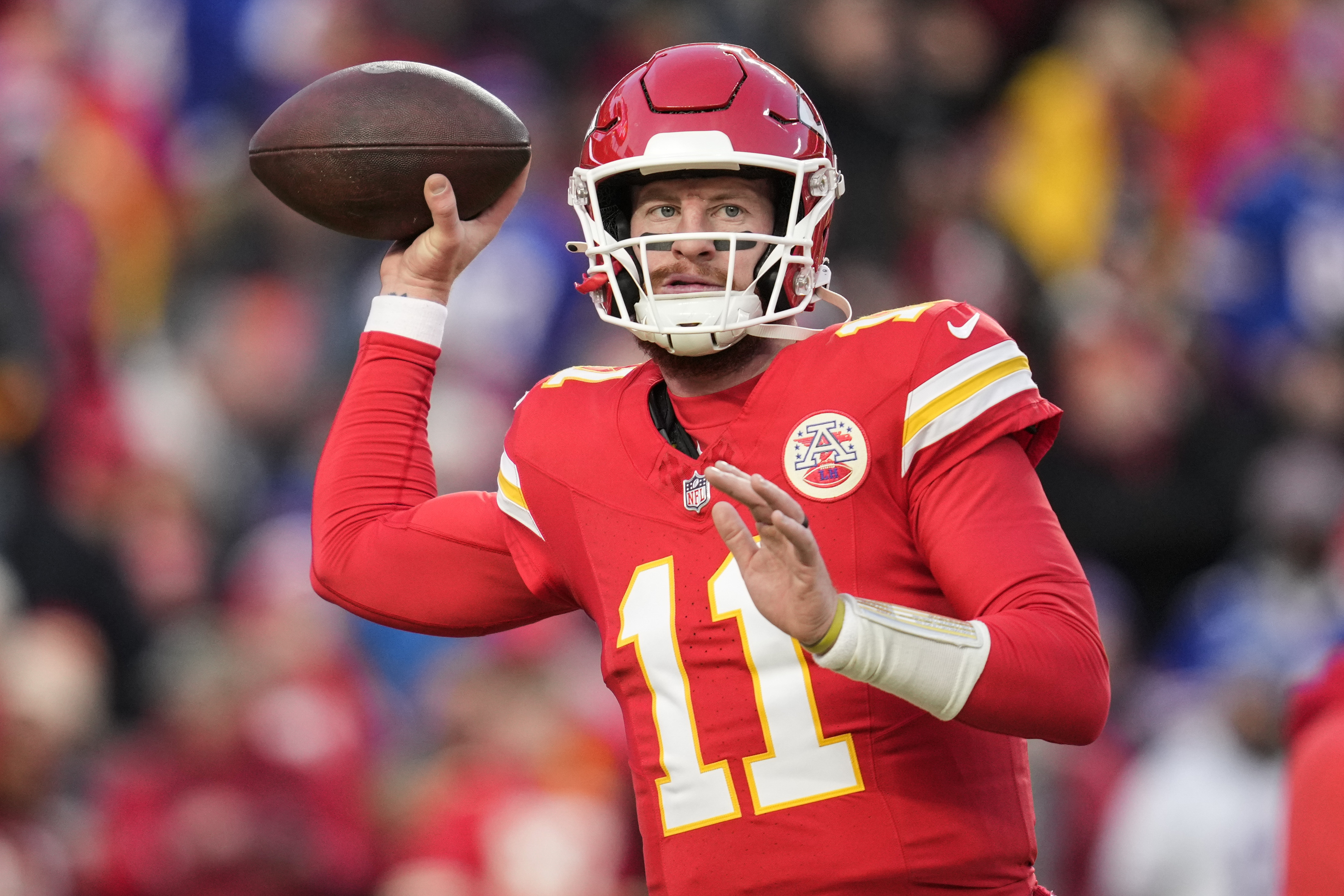 FILE - Kansas City Chiefs quarterback Carson Wentz (11) warms up before the AFC Championship NFL football game against the Buffalo Bills, Jan. 26, 2025, in Kansas City, Mo. 