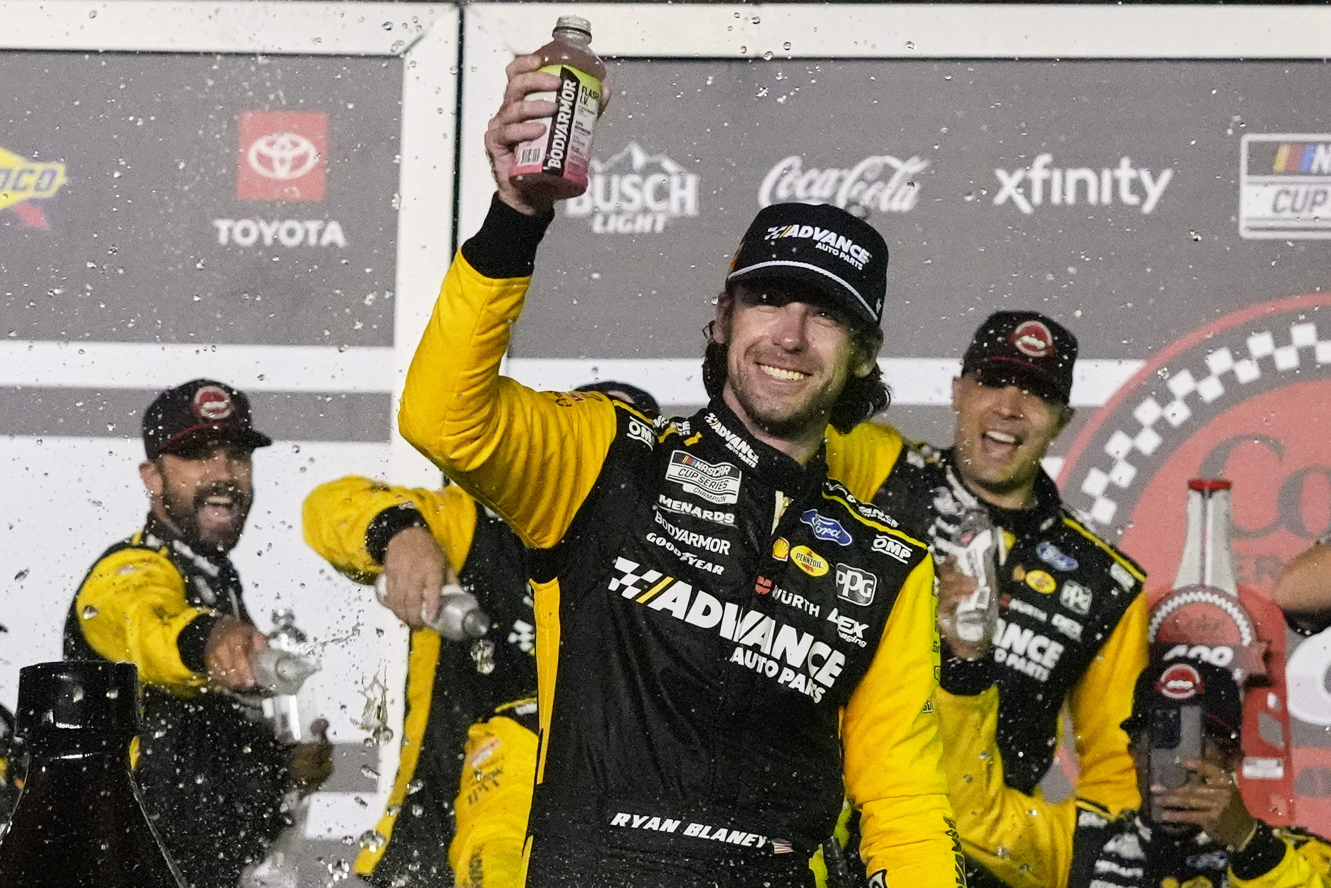 Ryan Blaney, front, celebrates in Victory Lane after winning a NASCAR Cup Series auto race at Daytona International Speedway, Saturday, Aug. 23, 2025, in Daytona Beach, Fla.