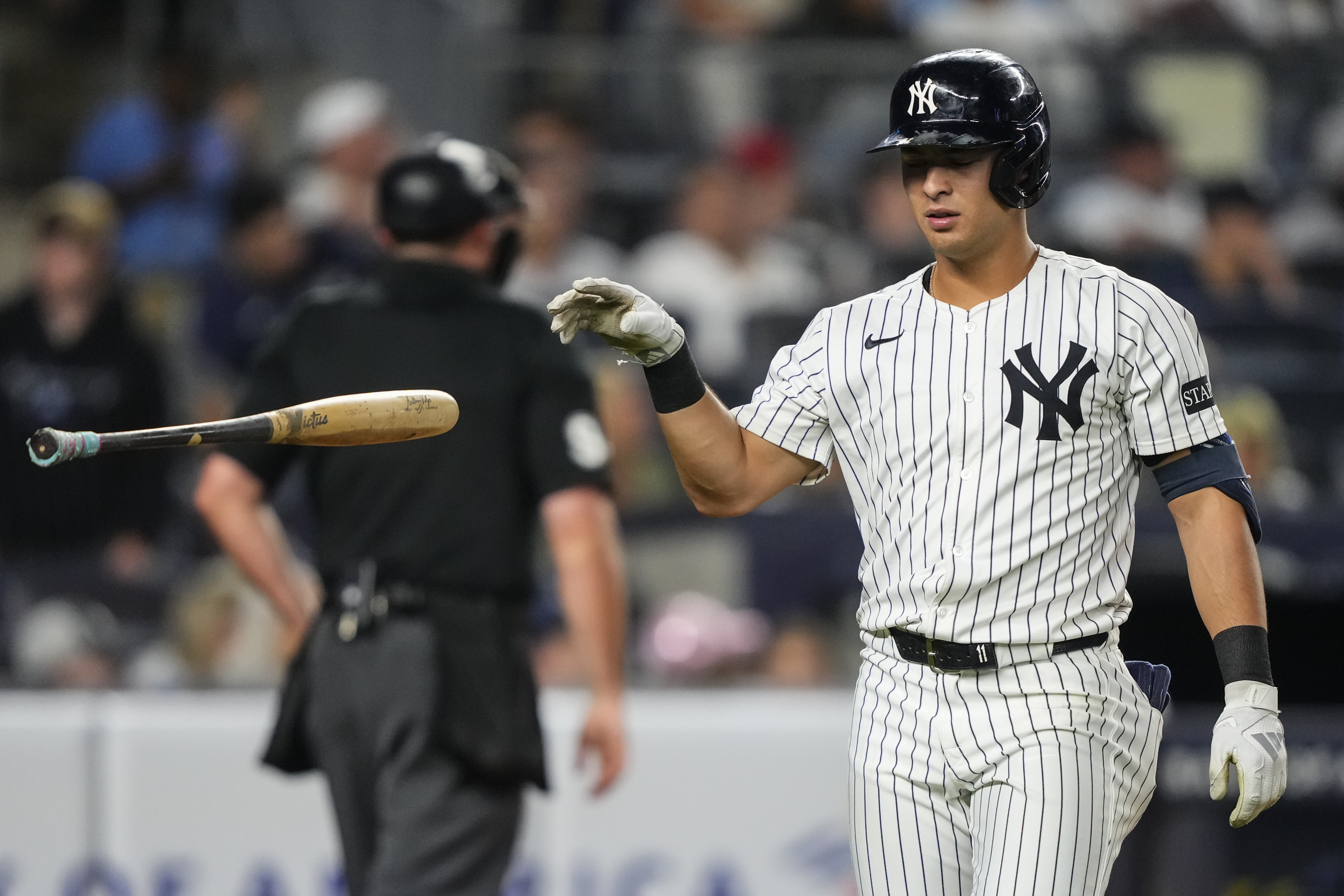 New York Yankees' Anthony Volpe (11) drops a bat after striking out during the fourth inning of a baseball game against the Minnesota Twins, Wednesday, Aug. 13, 2025, in New York. 