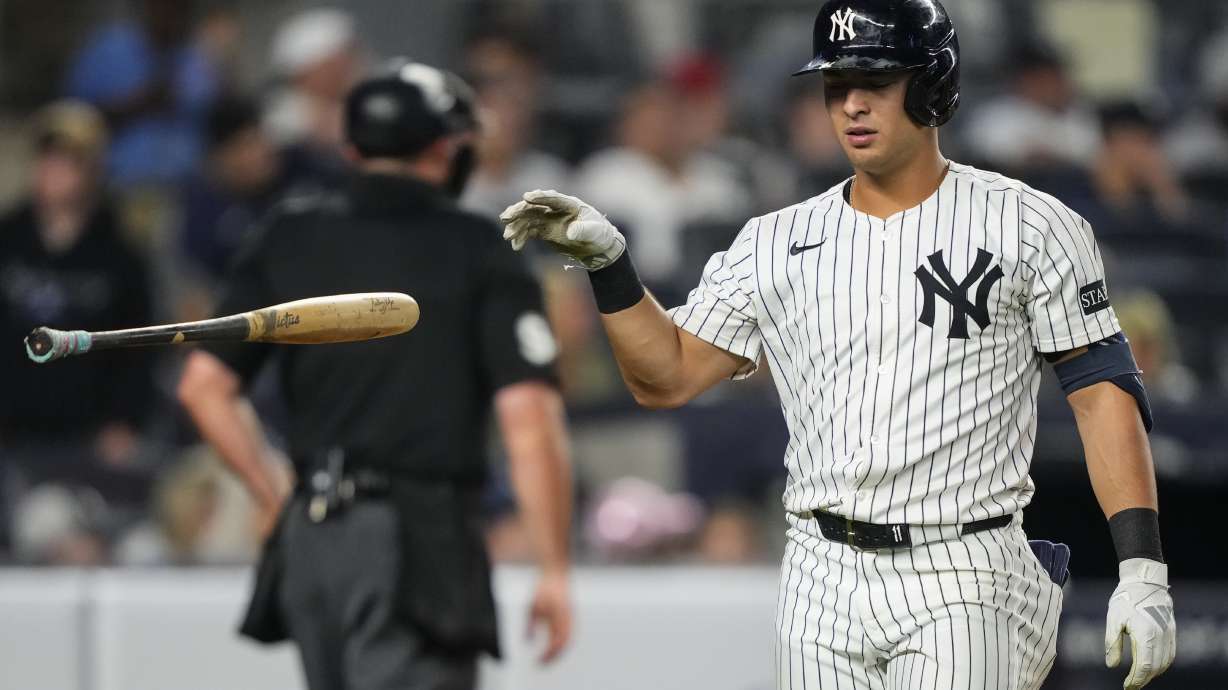 New York Yankees' Anthony Volpe (11) drops a bat after striking out during the fourth inning of a baseball game against the Minnesota Twins, Wednesday, Aug. 13, 2025, in New York.