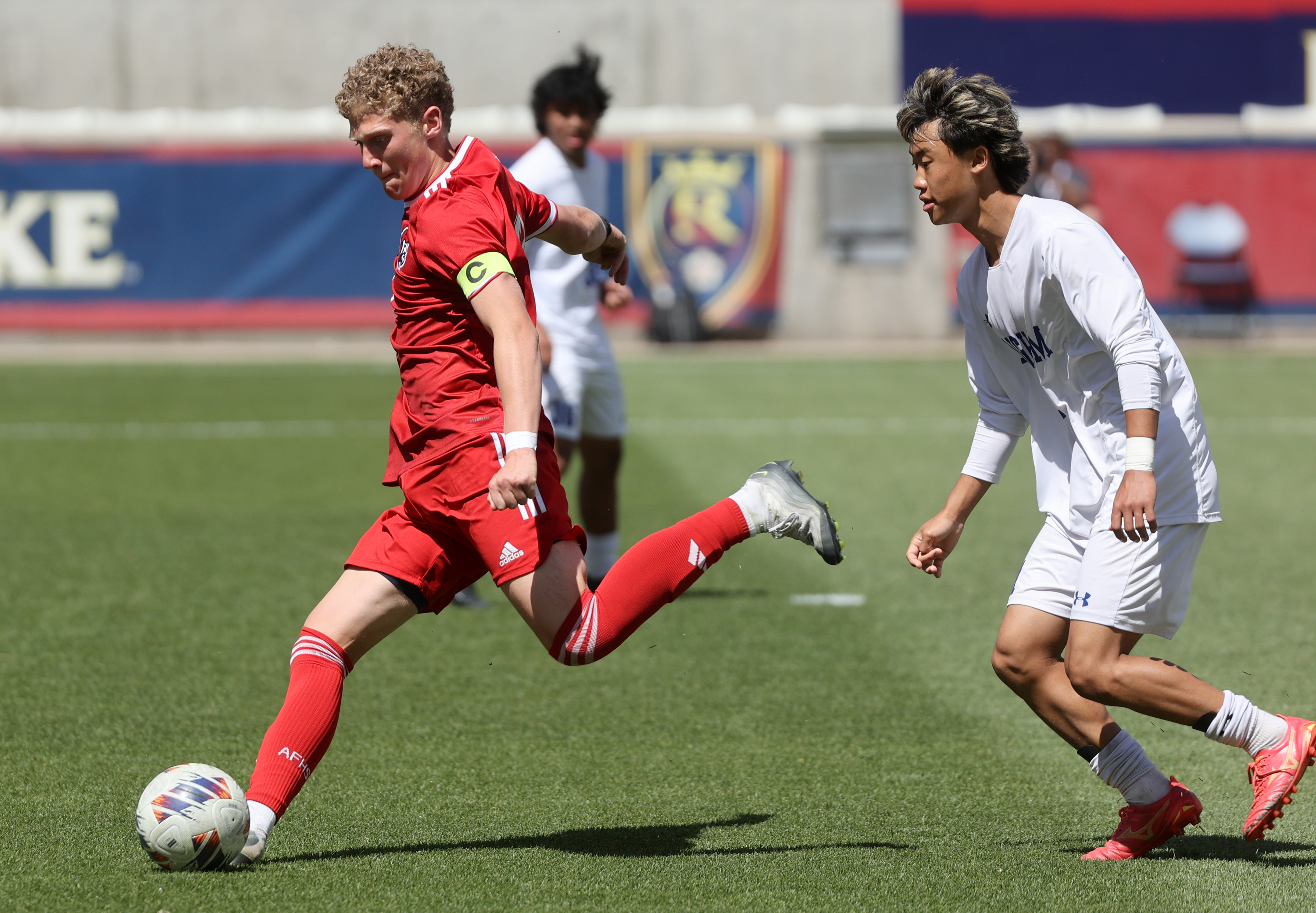 American Fork’s Lewis Knecht kicks the ball during the boys 6A state soccer championship game against Bingham at America First Field in Sandy on Thursday, May 22, 2025. American Fork won 1-0.