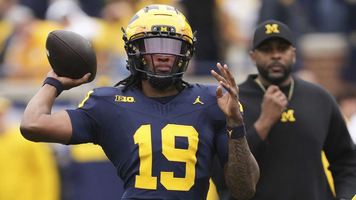 FILE - Michigan quarterback Bryce Underwood throws during an NCAA college football spring game in Ann Arbor, Mich., Saturday, April 19, 2025.