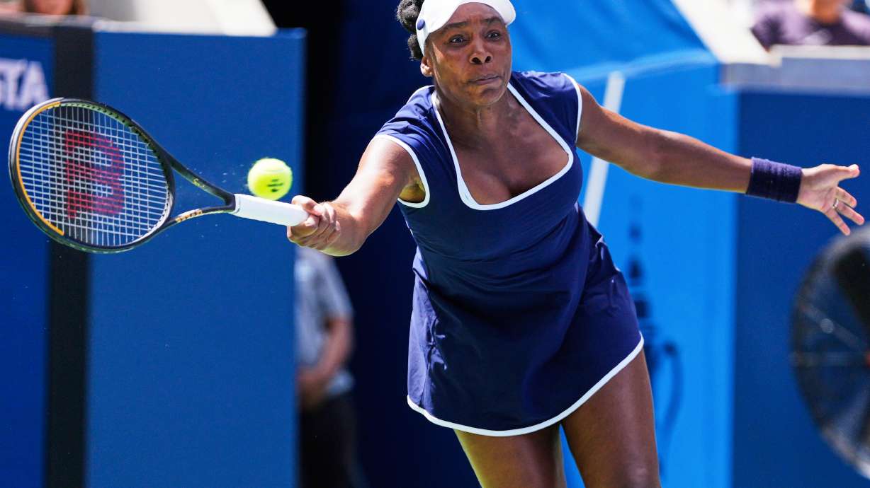 Venus Williams returns a shot during the mixed doubles competition of the U.S. Open tennis tournament in New York, Tuesday, Aug. 19, 2025.
