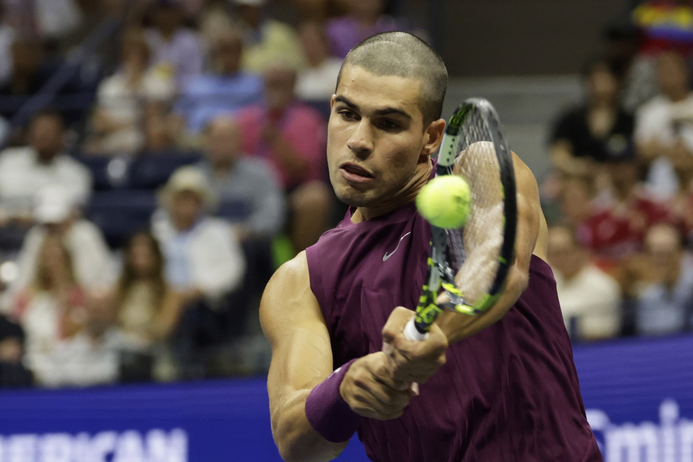 Carlos Alcaraz, of Spain, returns a shot to Reilly Opelka, of the United States, during the first round of the U.S. Open tennis championships, Monday, Aug. 25, 2025, in New York. 