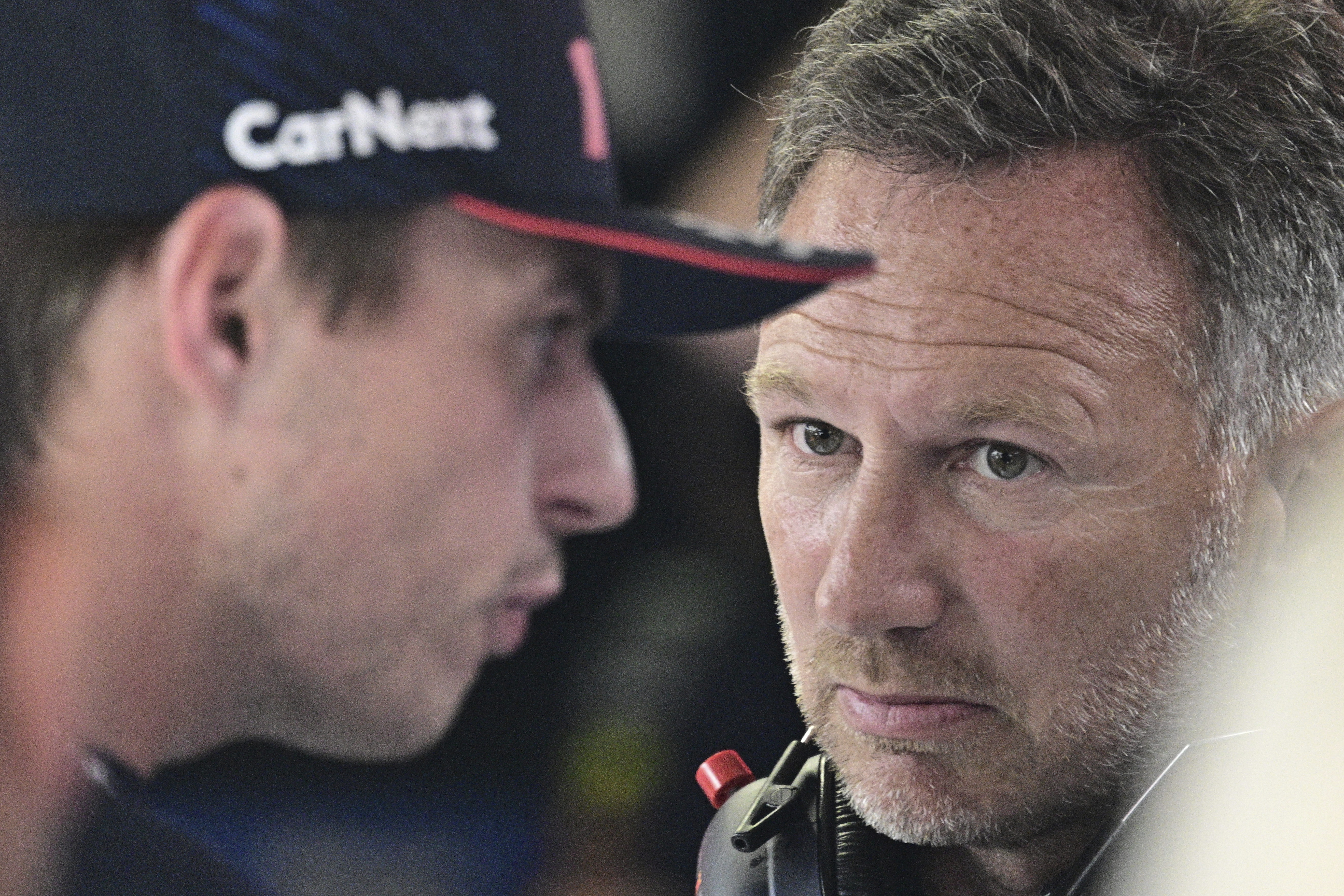 FILE - Red Bull team principal Christian Horner, right, talks to Red Bull driver Max Verstappen of the Netherlands before the qualifying session ahead of Sunday's Formula One Italian Grand Prix auto race, at the Monza racetrack, in Monza, Italy, Sept. 2, 2023.