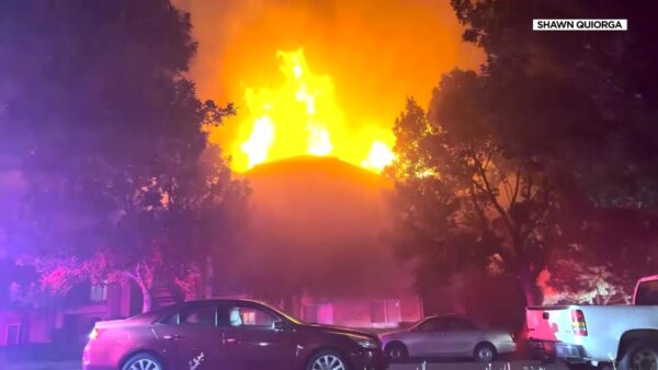 One tenant was injured in a large fire at an Eagle Mountain apartment complex early Tuesday. Six sheriff's deputies were treated for smoke inhalation.