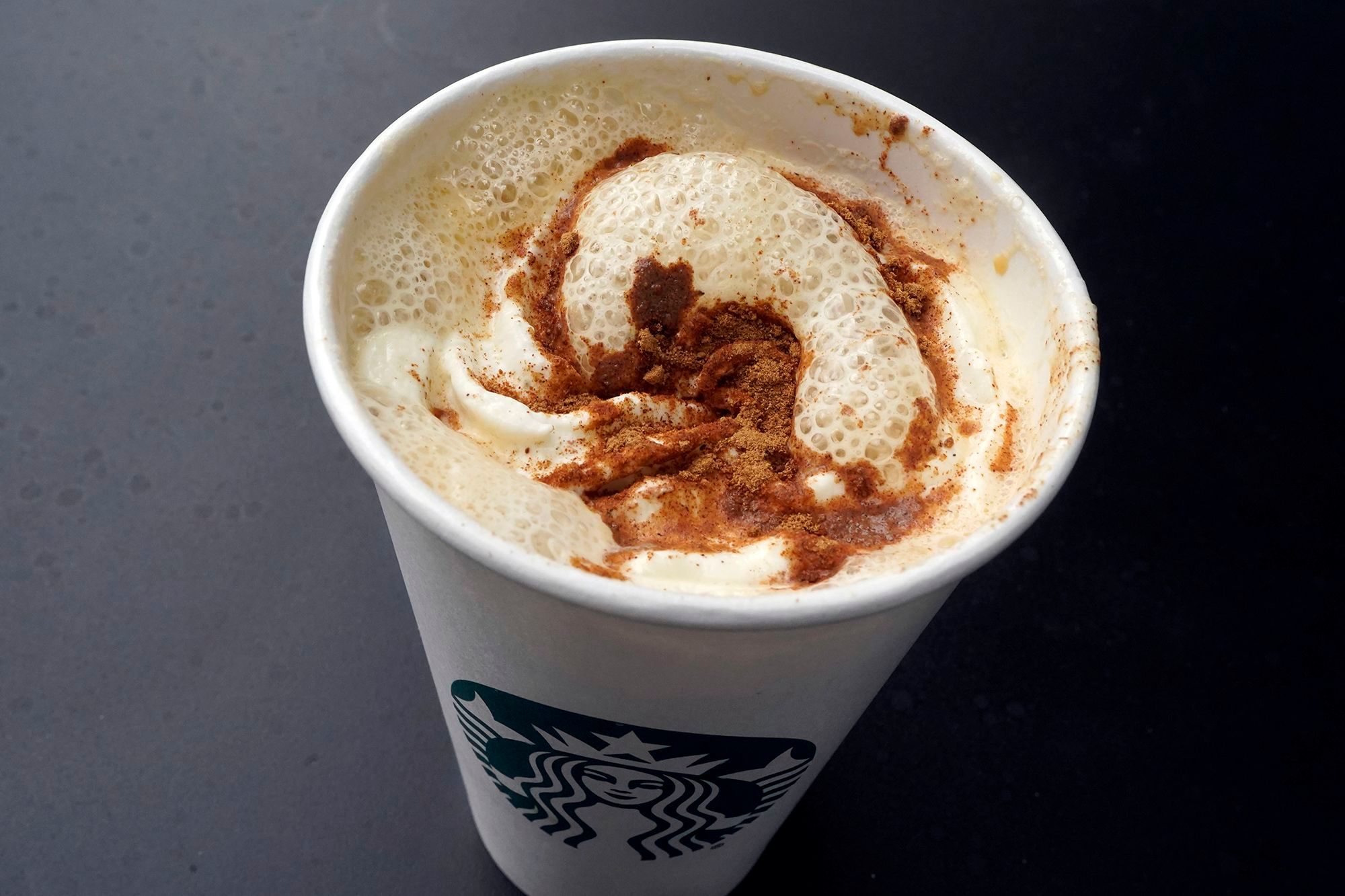 A Pumpkin Spice Latte drink rests on a table at a Starbucks in New York.