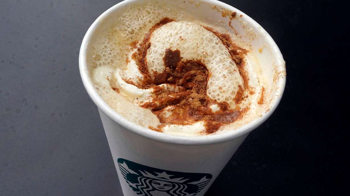 A Pumpkin Spice Latte drink rests on a table at a Starbucks in New York.