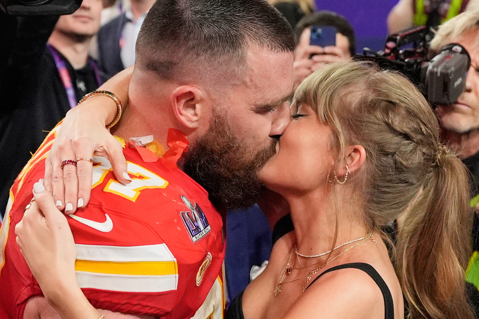 FILE - Kansas City Chiefs tight end Travis Kelce (87) and Taylor Swift kiss after the Chiefs defeated the San Francisco 49ers in the NFL Super Bowl 58 football game on Feb. 11, 2024, in Las Vegas. 