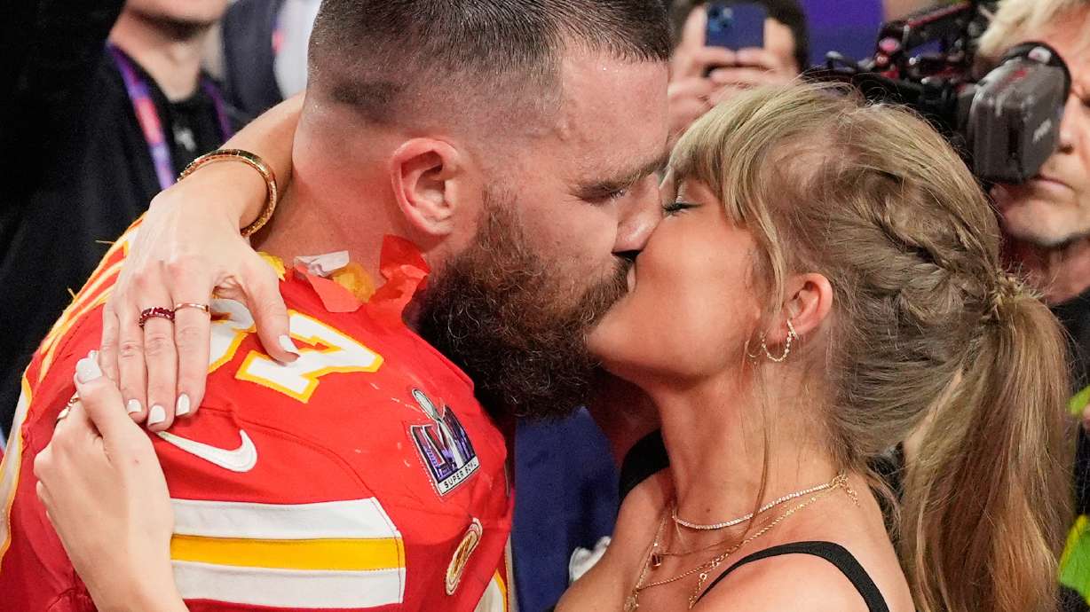 FILE - Kansas City Chiefs tight end Travis Kelce (87) and Taylor Swift kiss after the Chiefs defeated the San Francisco 49ers in the NFL Super Bowl 58 football game on Feb. 11, 2024, in Las Vegas.