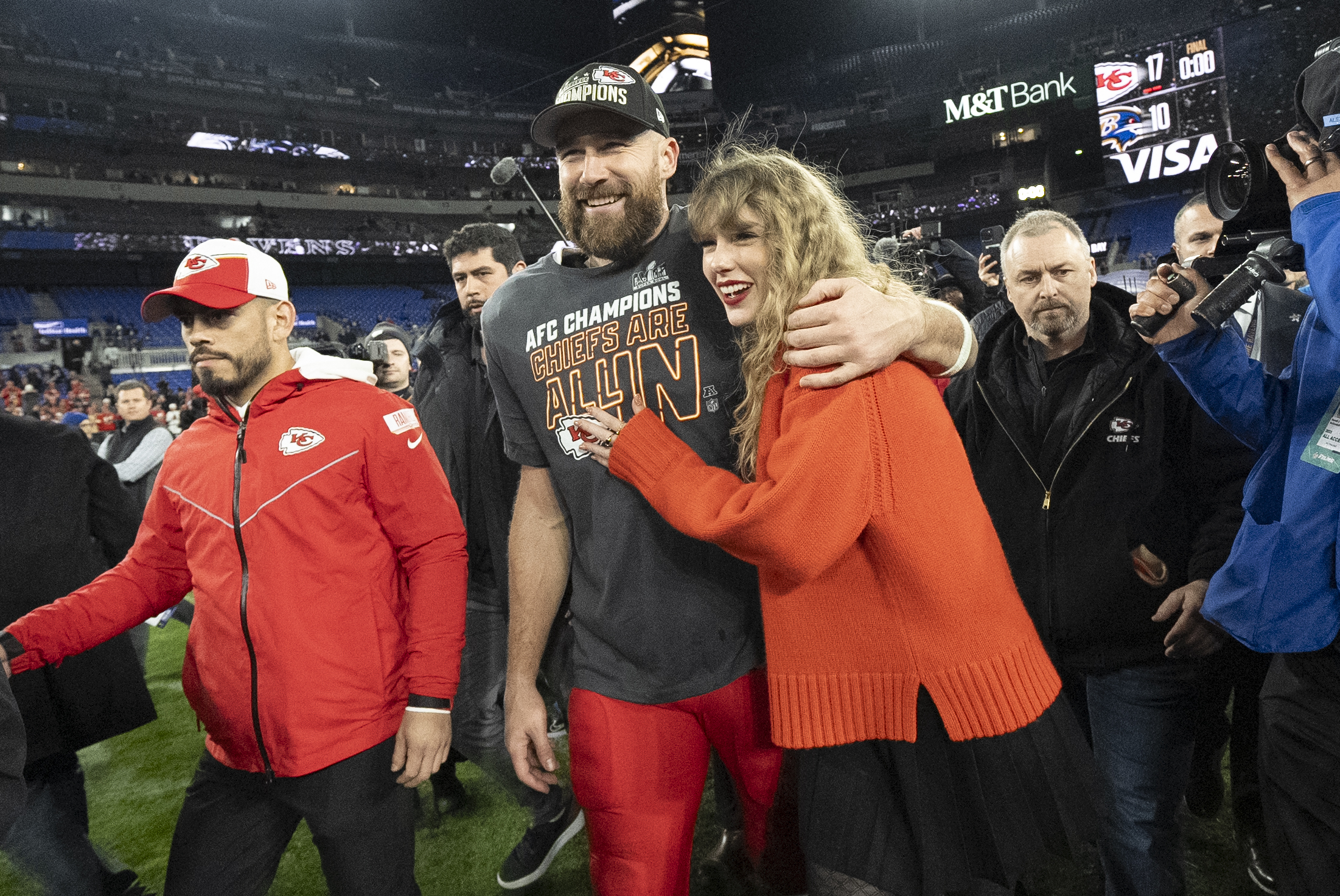FILE - Kansas City Chiefs tight end Travis Kelce and Taylor Swift walk together after an AFC Championship NFL football game between the Chiefs and the Baltimore Ravens, Jan. 28, 2024, in Baltimore. 