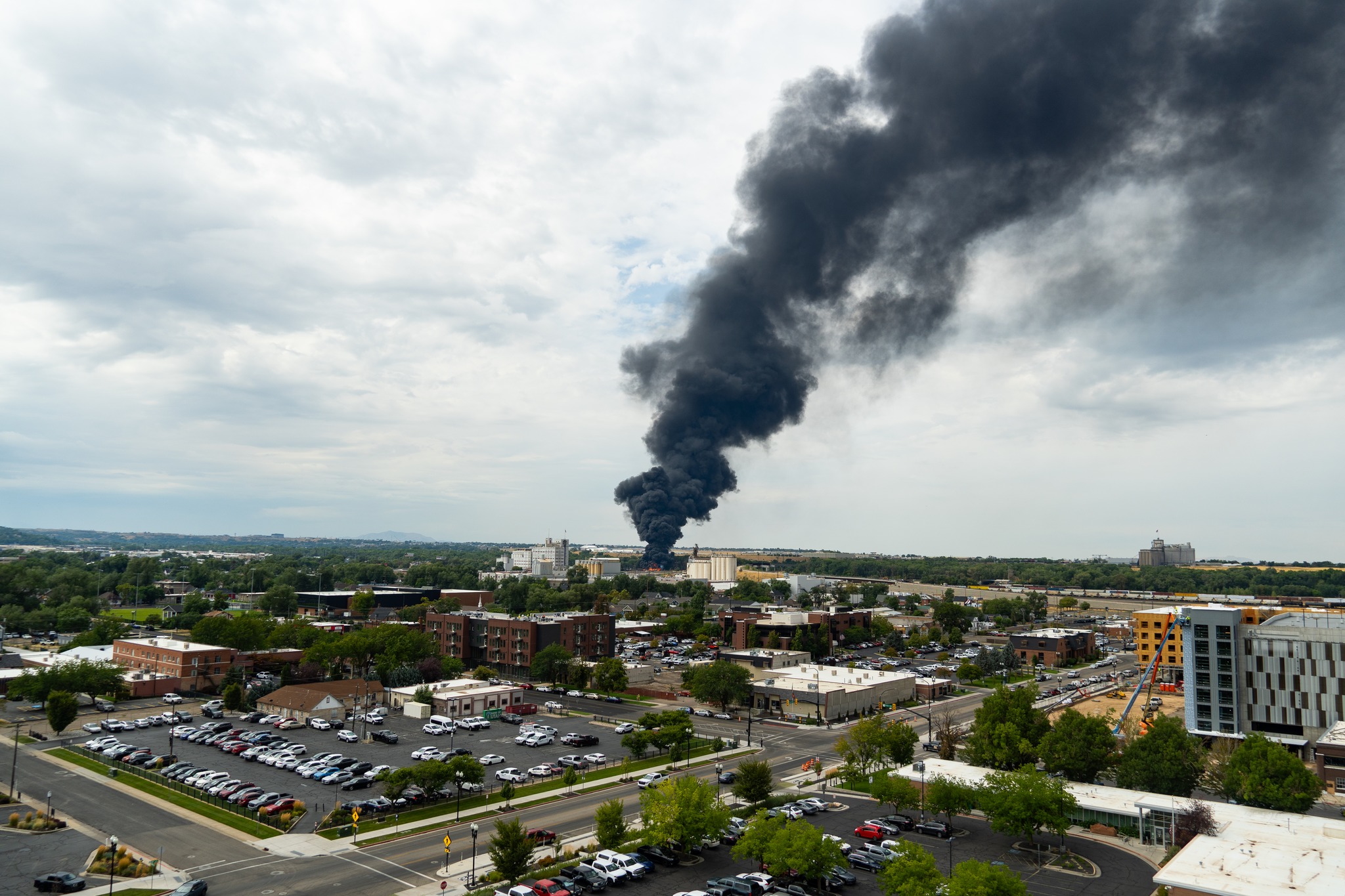 An intense fire on Tuesday in an Ogden rail yard sent heavy clouds of black smoke into the air.