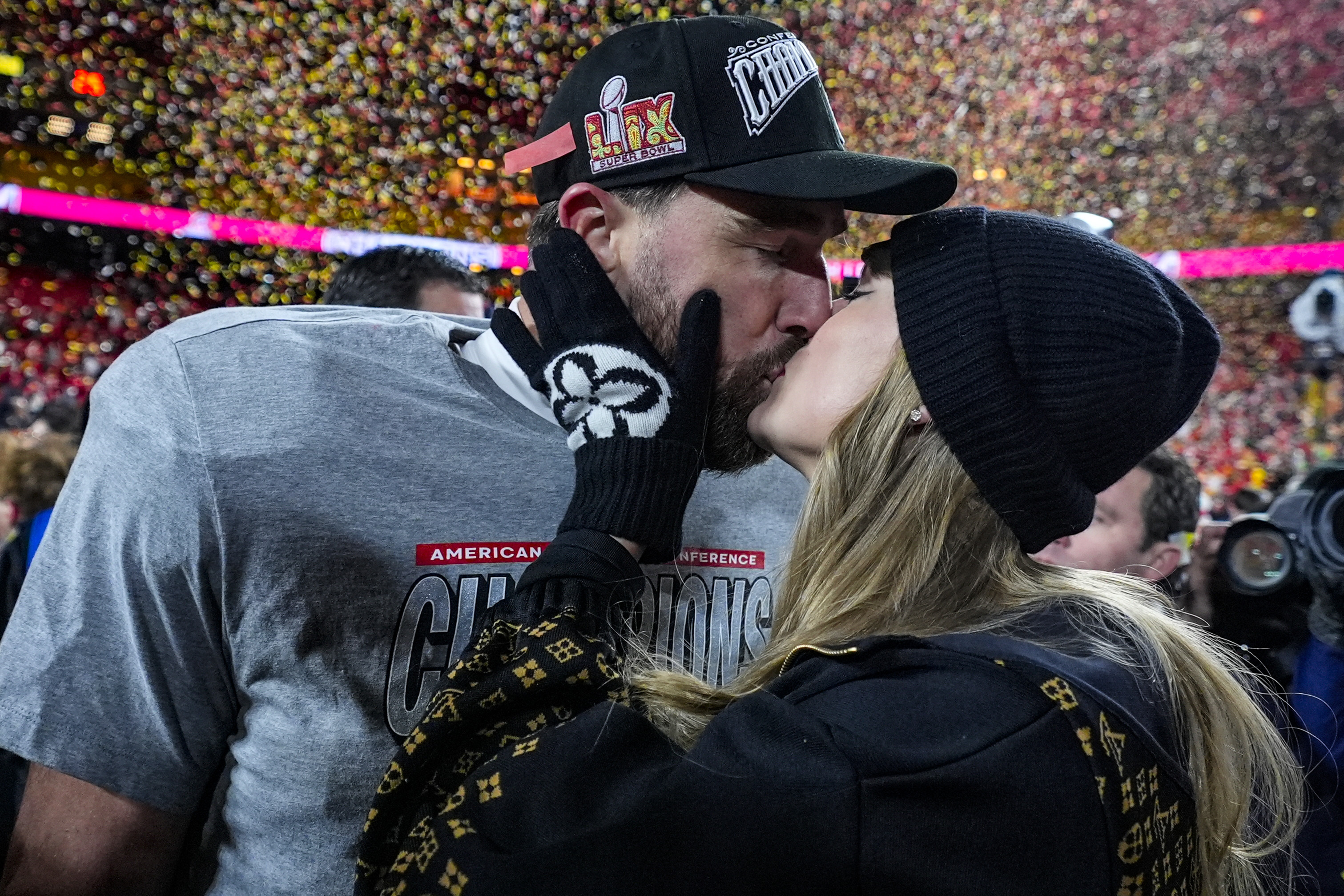 Kansas City Chiefs tight end Travis Kelce and singer Taylor Swift after the AFC Championship game on Jan. 26 in Kansas City, Mo. Kelce and Swift announced their engagement on Tuesday.
