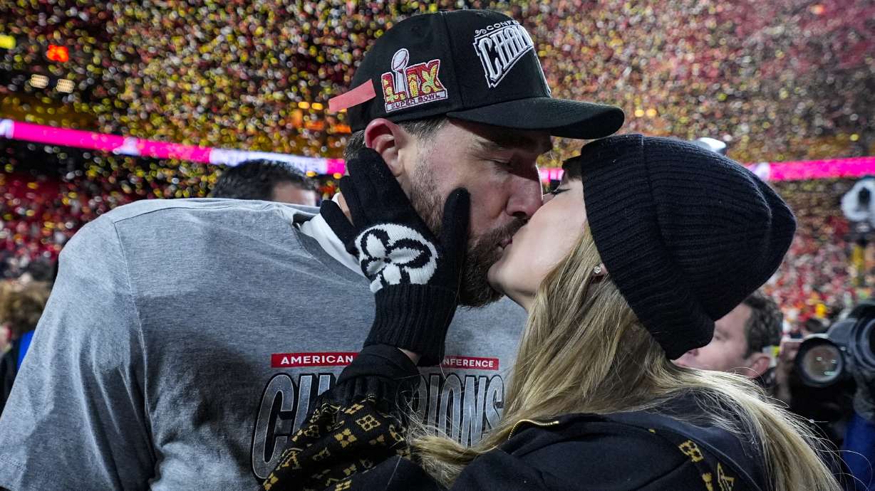 FILE - Kansas City Chiefs tight end Travis Kelce and Taylor Swift kiss after the AFC Championship NFL football game against the Buffalo Bills, Jan. 26, 2025, in Kansas City, Mo.